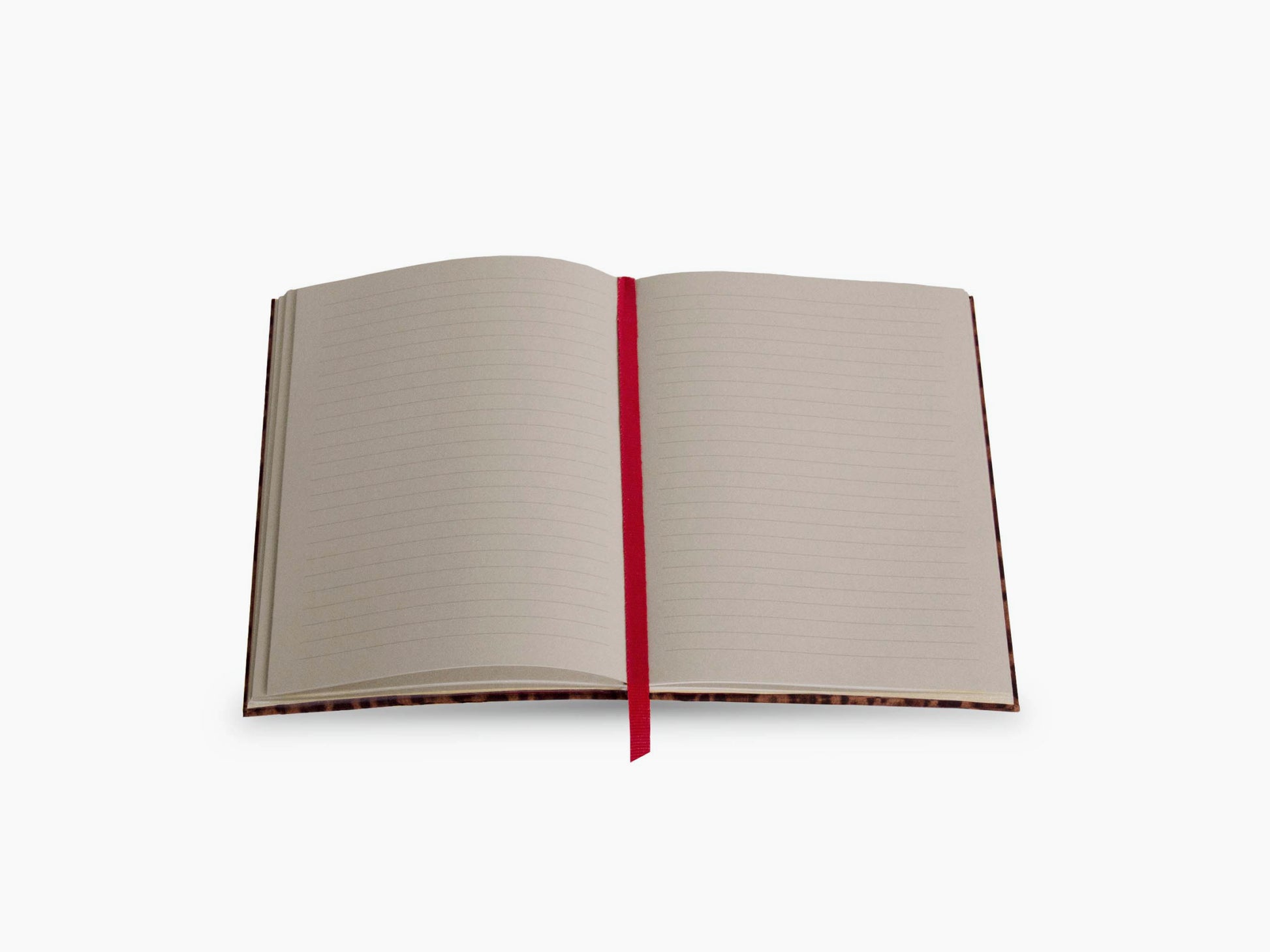 Open leopard print Assouline Wild Thoughts notebook with lined pages and a red ribbon bookmark.