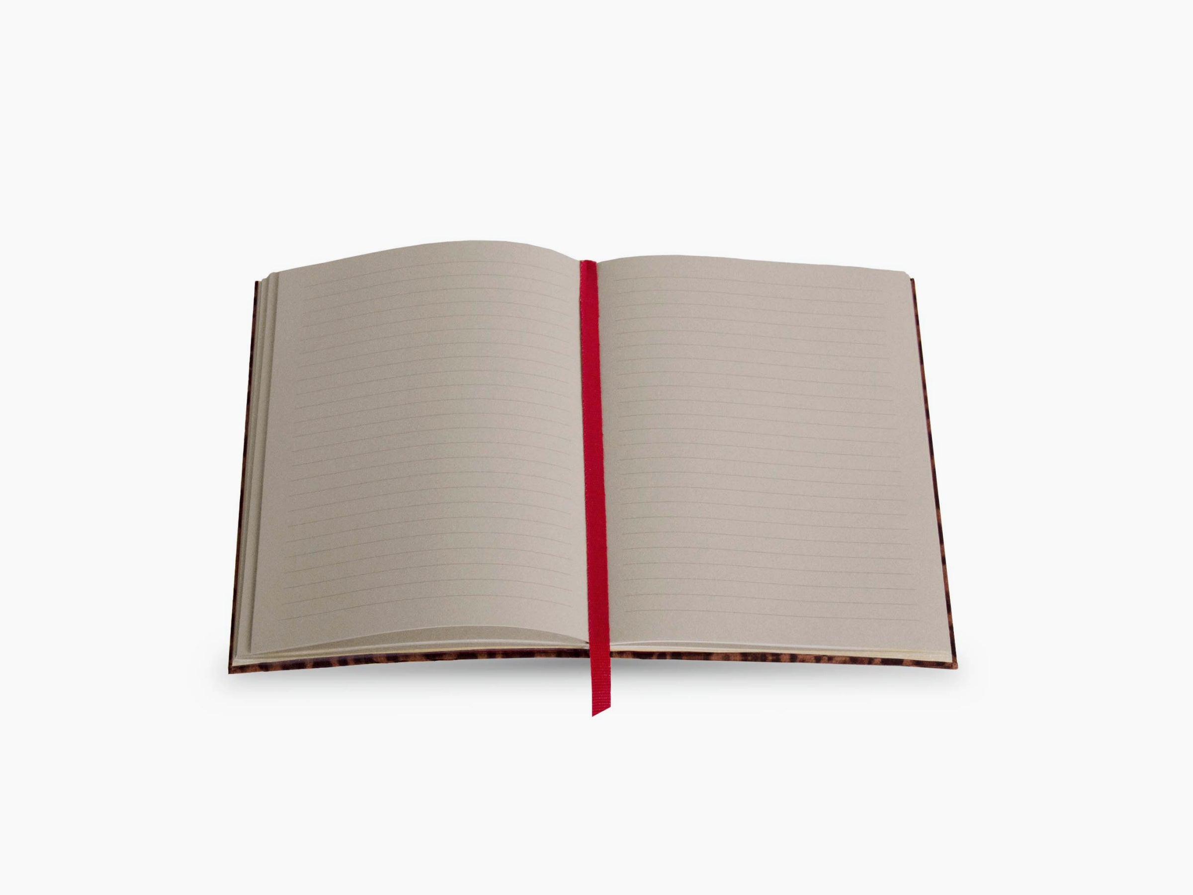 Open leopard print Assouline Wild Thoughts notebook with lined pages and a red ribbon bookmark.