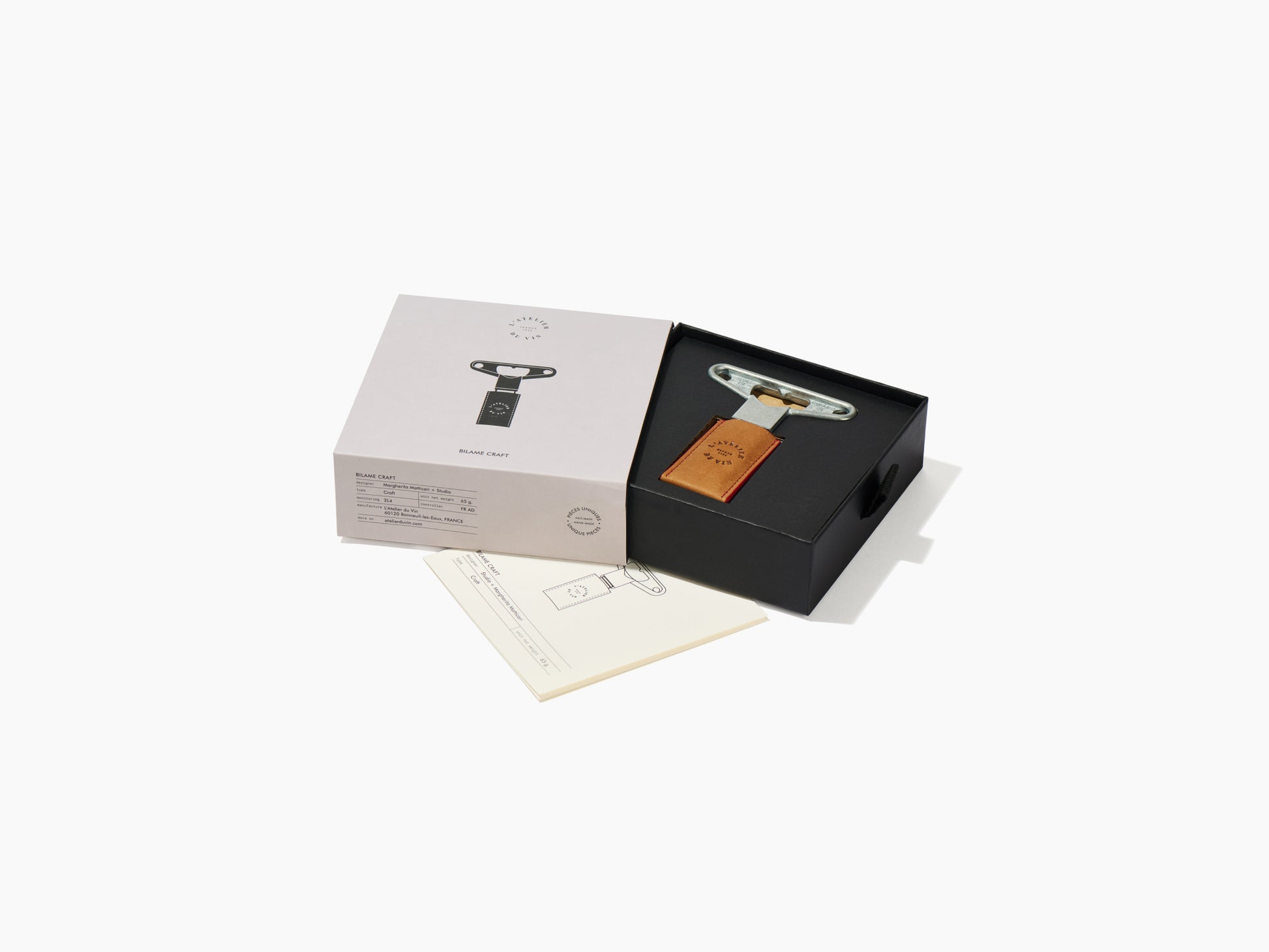 Bilame Craft twin blade corkscrew set in a black box with tan leather sheath beside pale packaging and instruction sheet