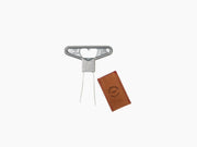 Close up of Oeno Motion Groom showing corks arranged around a round wooden base and chrome center.