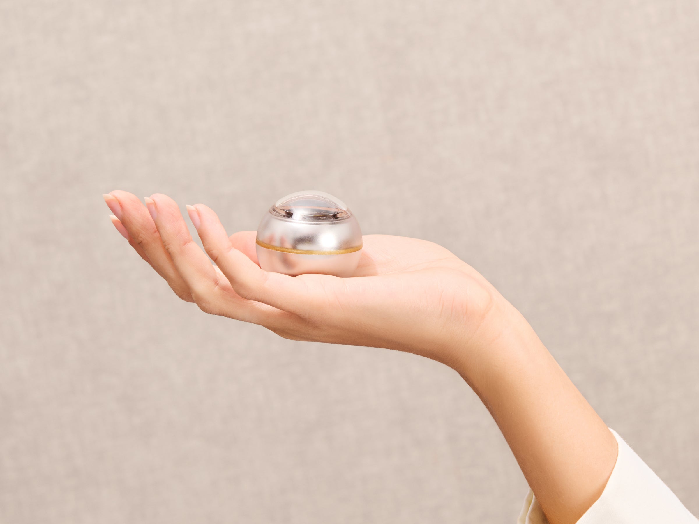 Bubble Indicator held in an open hand against a neutral background.