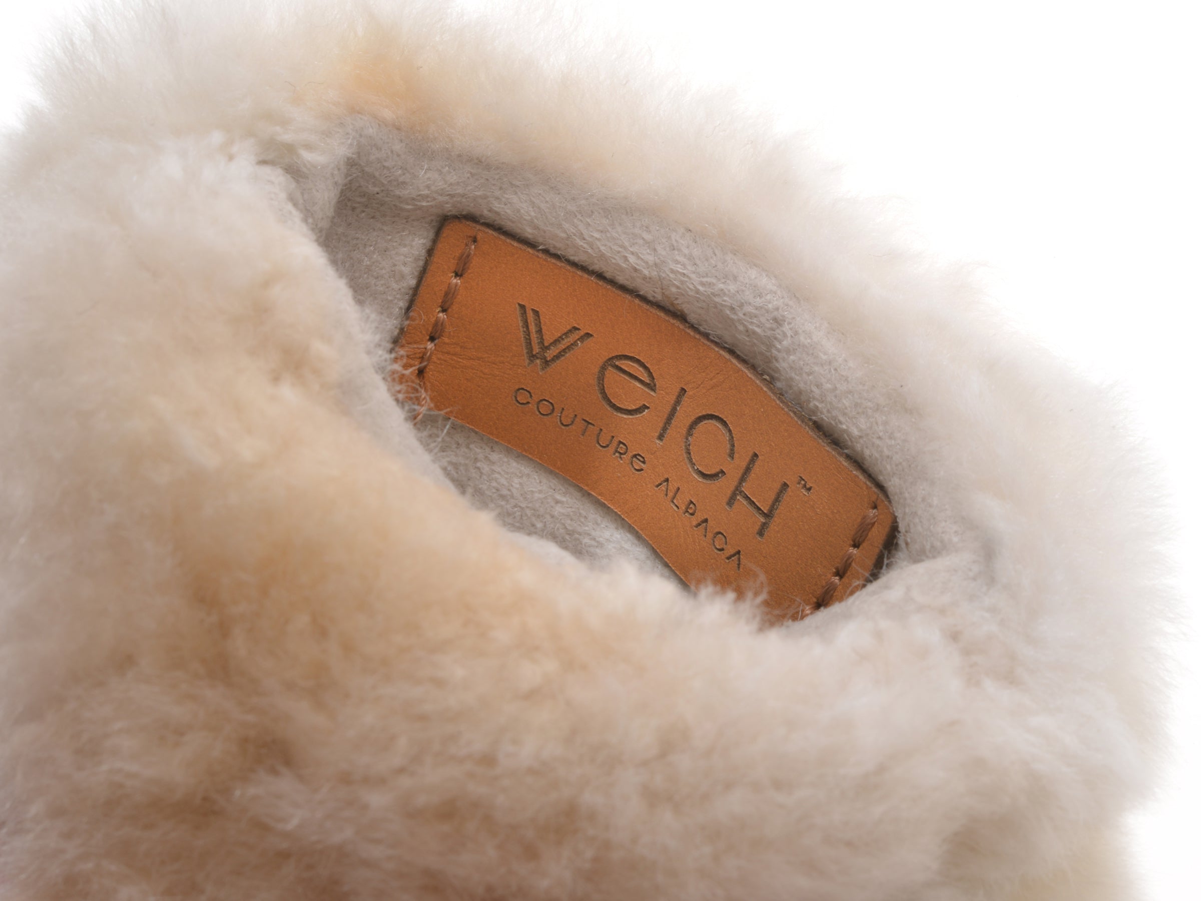 Interior view of the alpaca wrap with a tan leather tag Welch Couture Alpaca