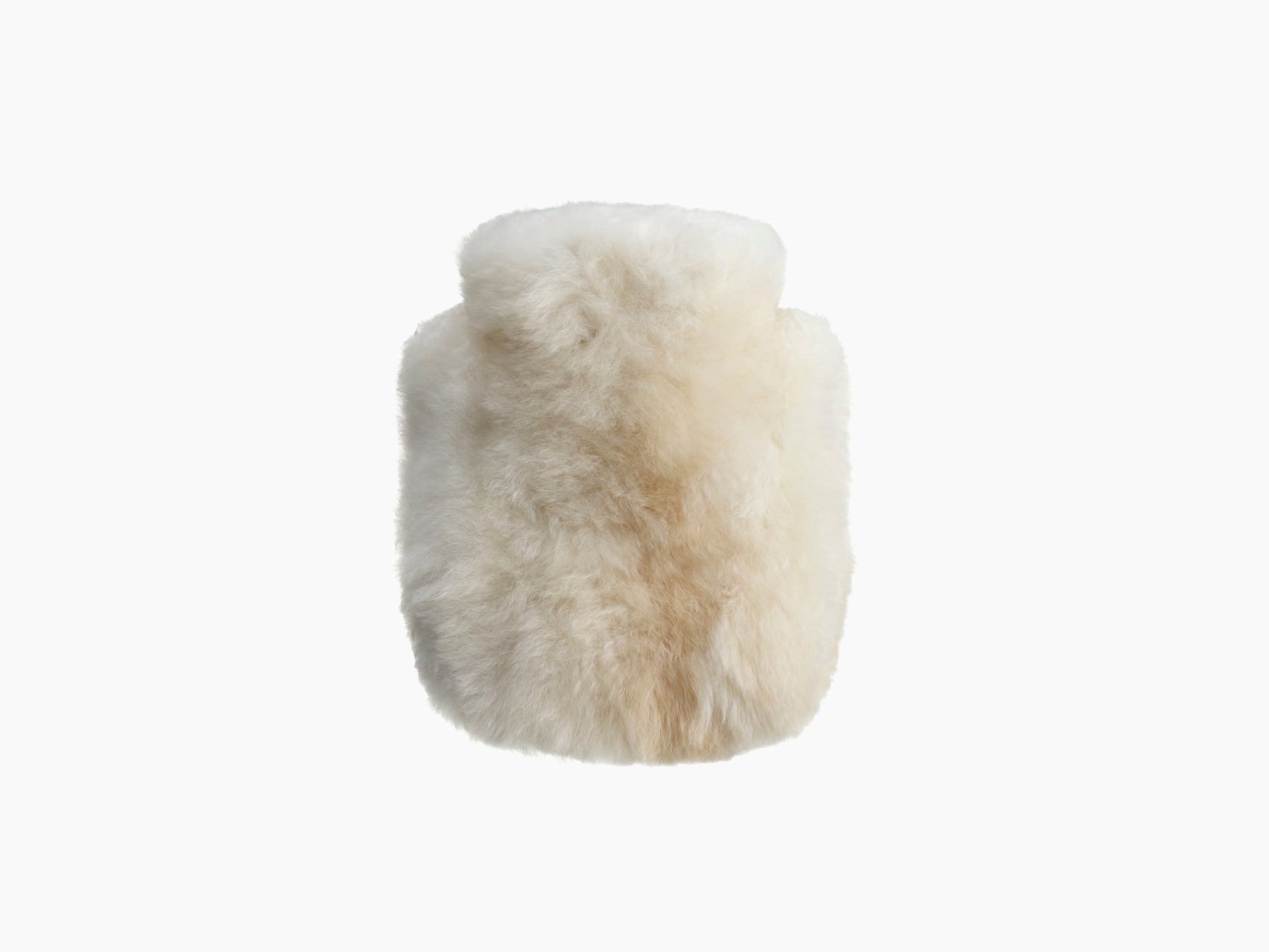 Creamy white alpaca wrapped hot water bottle CALMO 0.6L shown in close up.