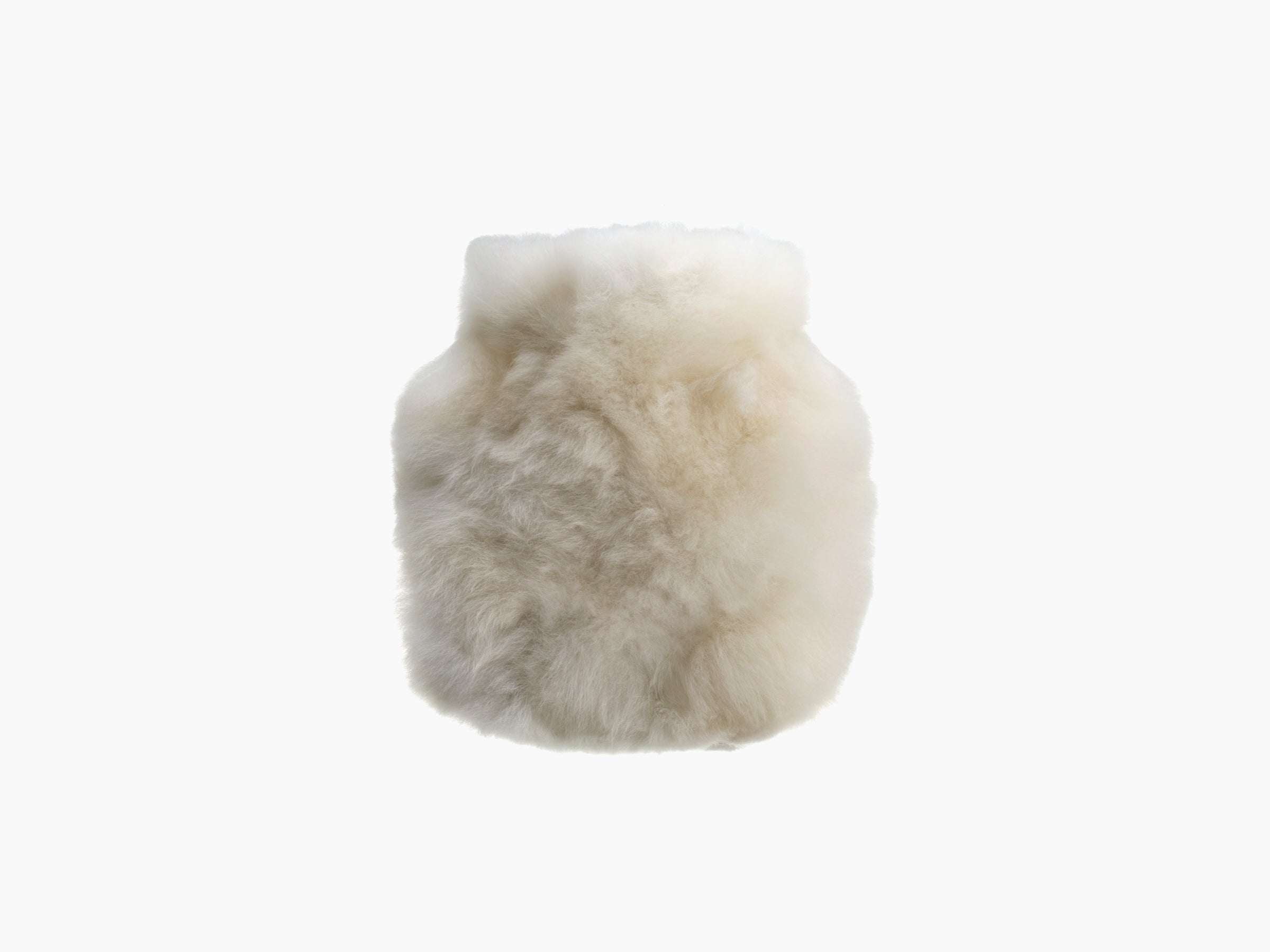 Cream white CALMO 0.6L hot water bottle wrapped in soft alpaca fiber.