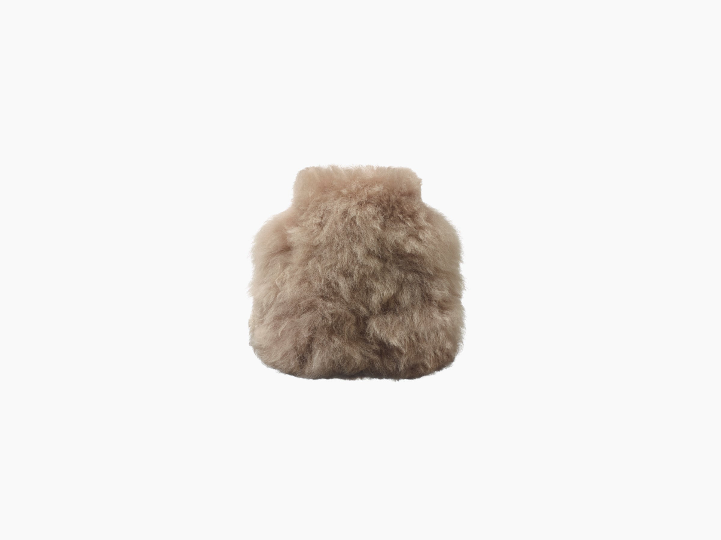 Beige fluffy hot water bottle wrapped in soft alpaca fur seen from the front