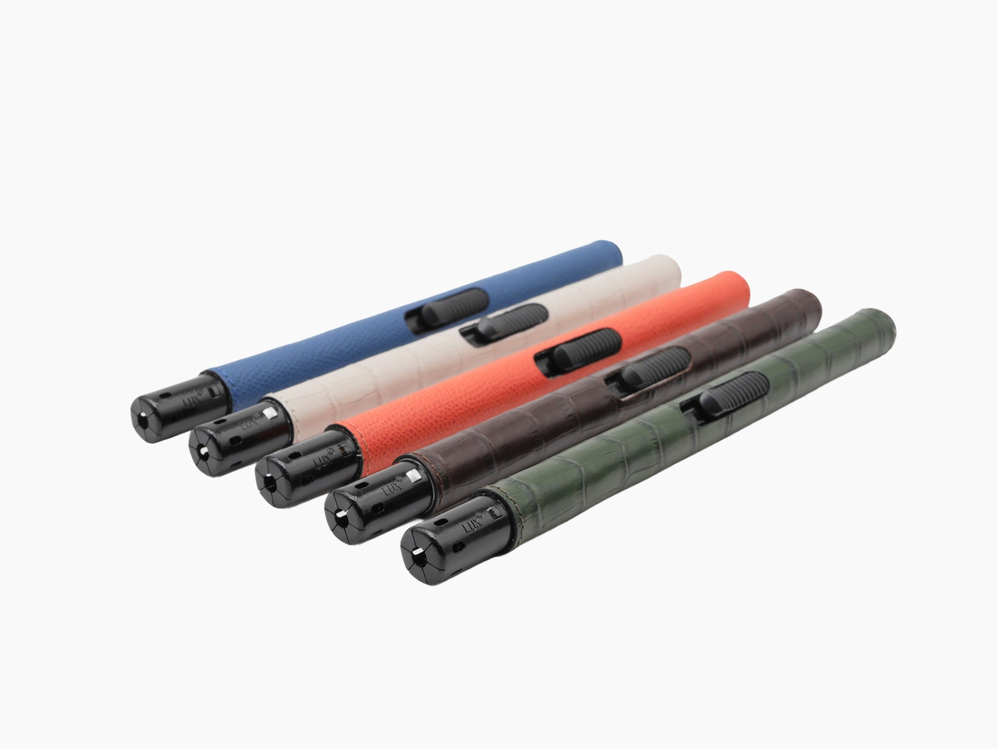Diagonal display of five candle lighters with colored leather wraps in blue beige orange brown and cream.