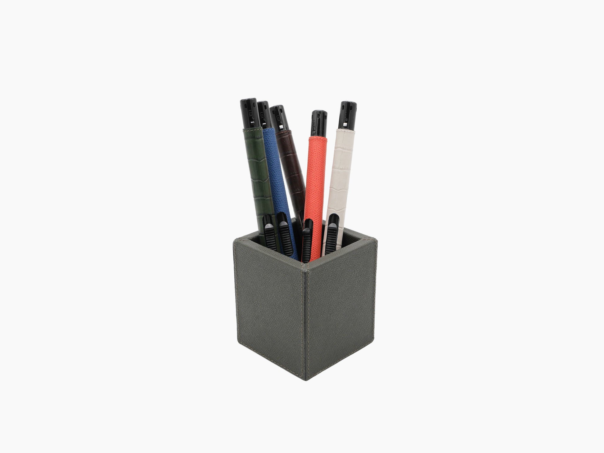 Five leather wrapped candle lighters standing upright in a square textured holder.