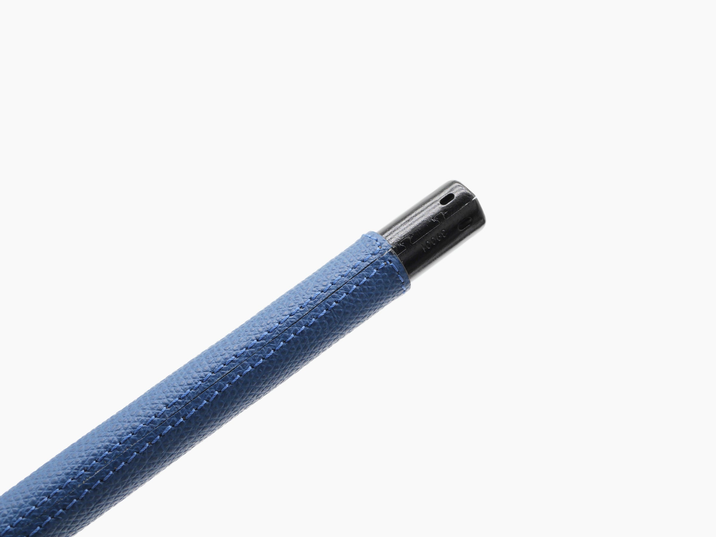 Side view of blue leather candle lighter shaft with black metal end on a white background