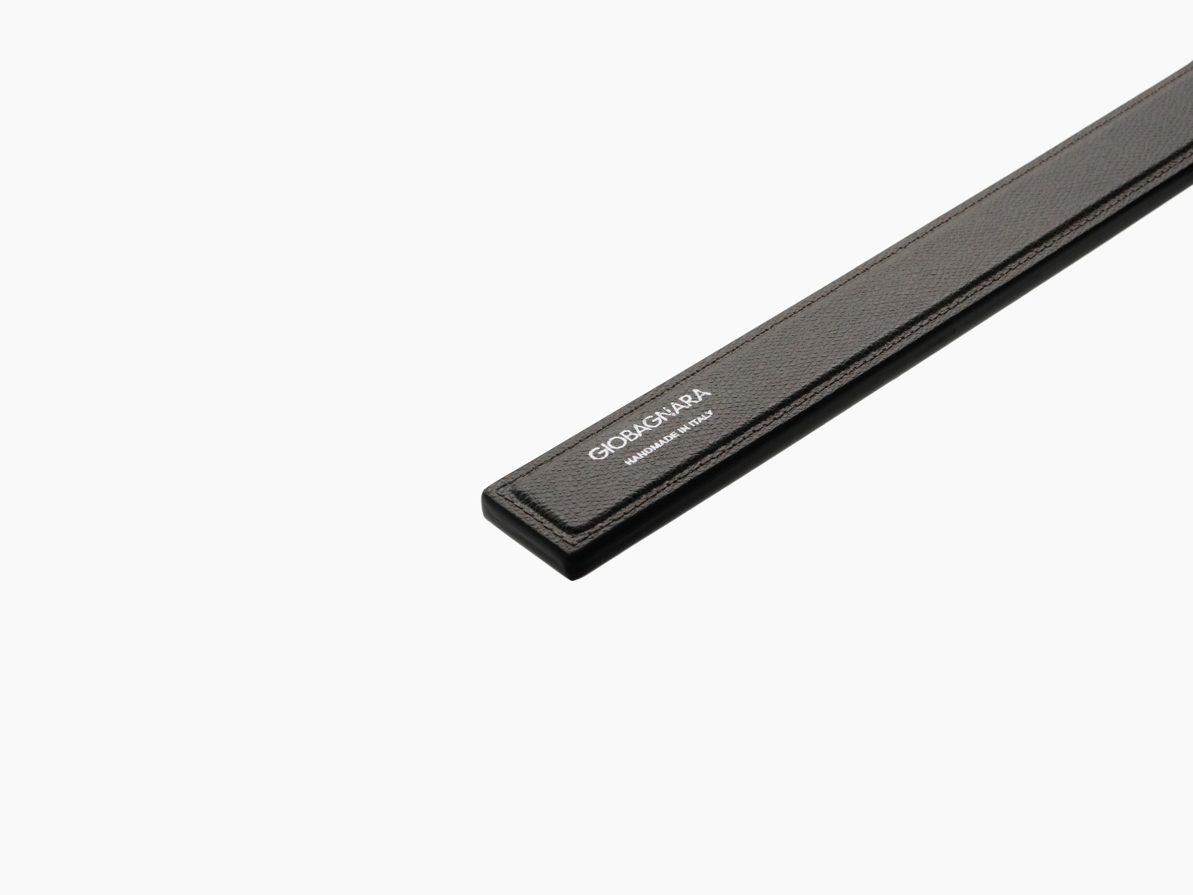 Close-up of dark brown leather shoehorn handle with GioBagnara branding