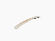 Curved buffalo horn shoehorn with beige leather handle on white background