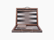 Open Bond backgammon case in walnut and leather with a leather inlay board and a folded grey pouch inside