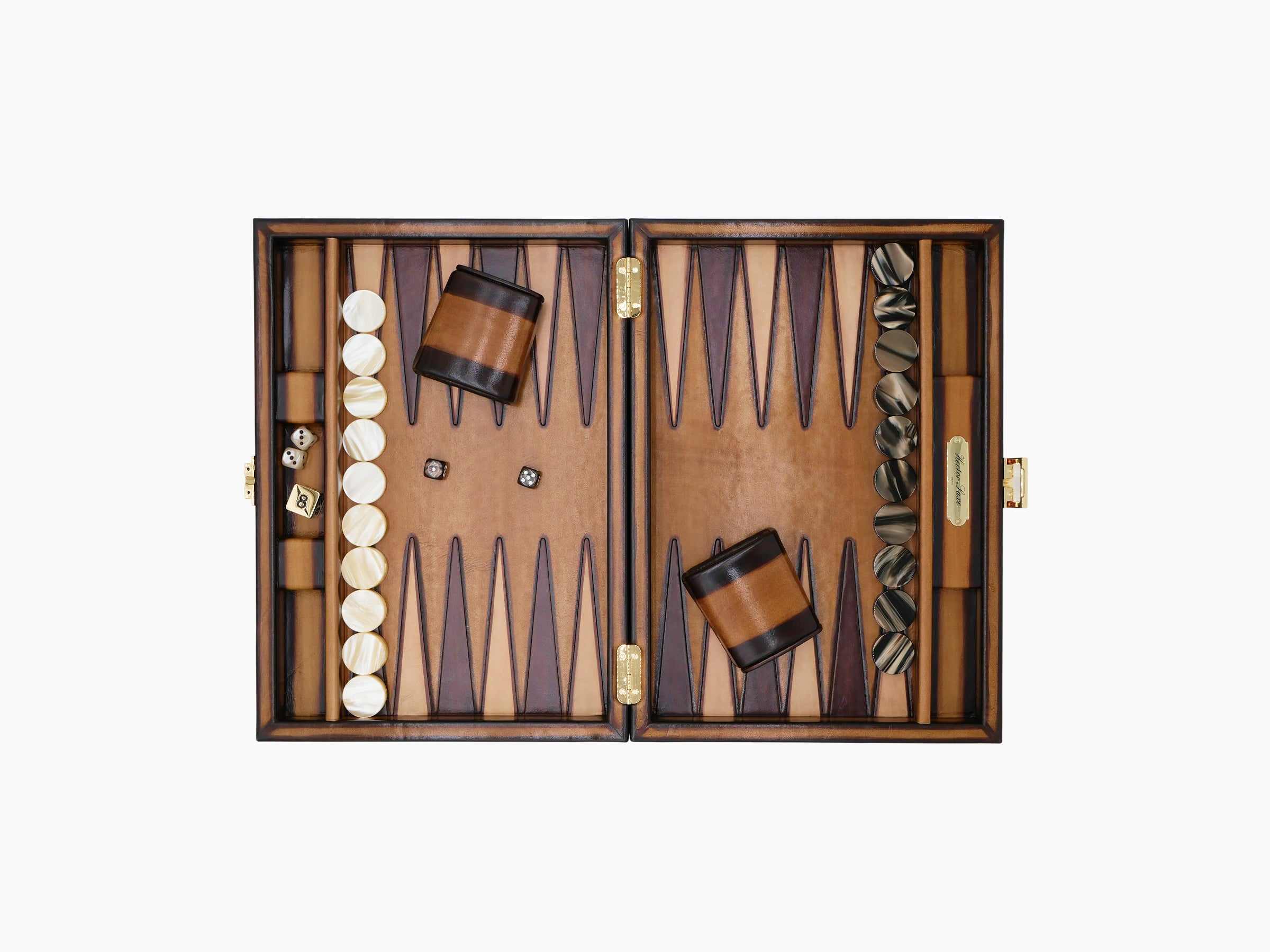Open patinable cognac leather backgammon set with white and dark checkers, dice, and leather playing pieces on a wood board.