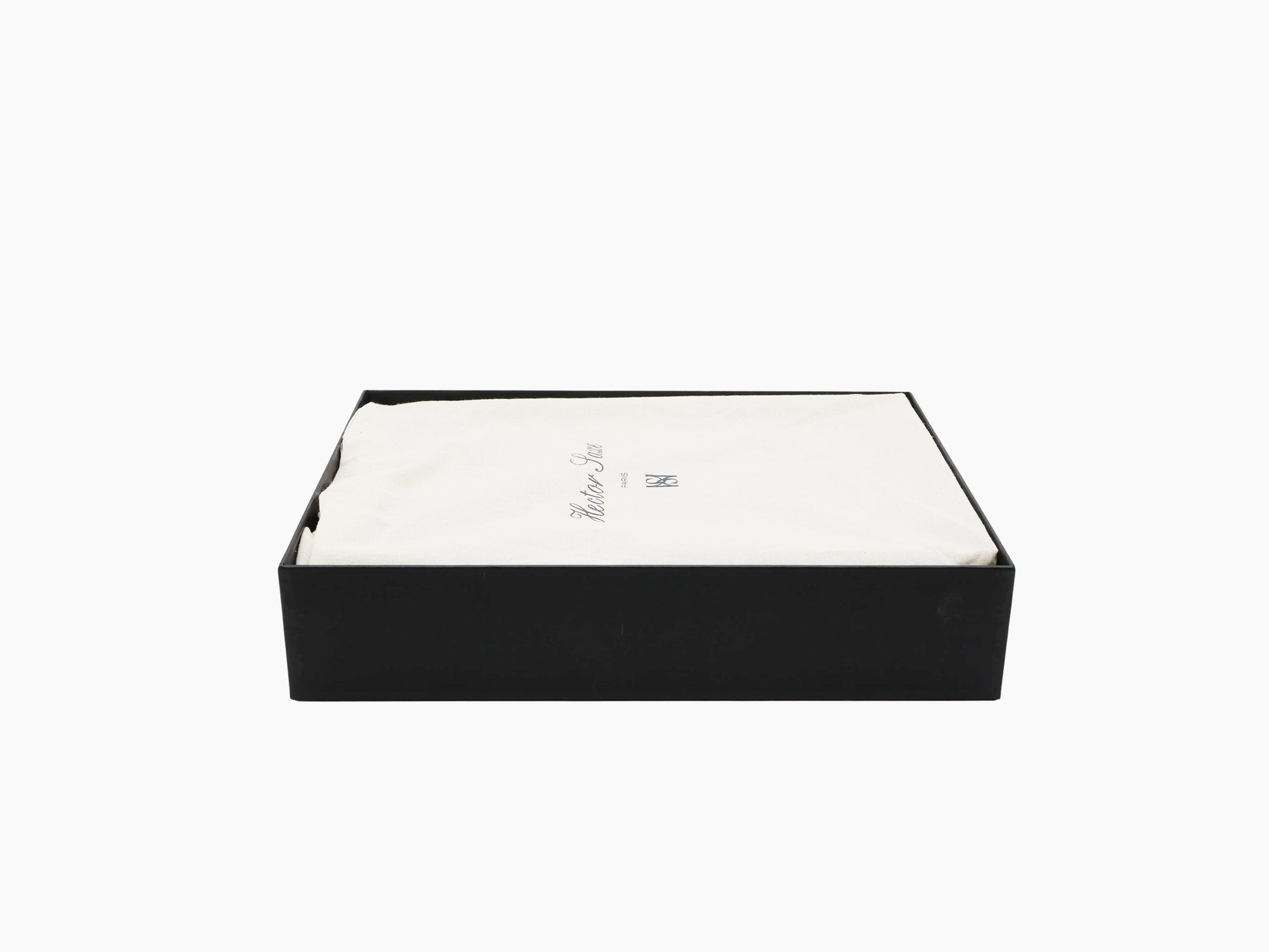 Open black rectangular gift box with white fabric lining, hinting at a patinable cognac backgammon set