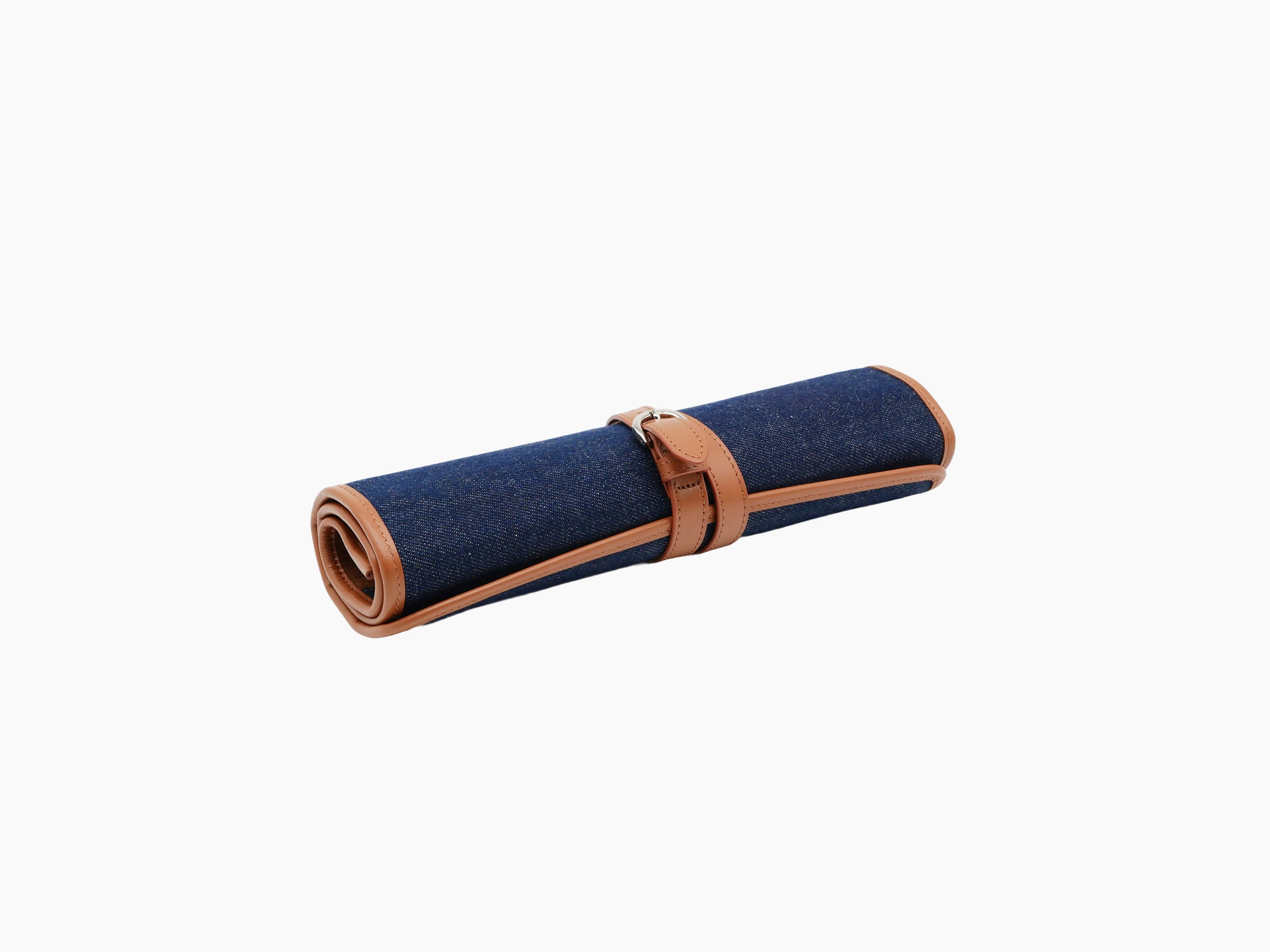 Backgammon travel set in blue denim with tan leather trim rolled up and strapped.