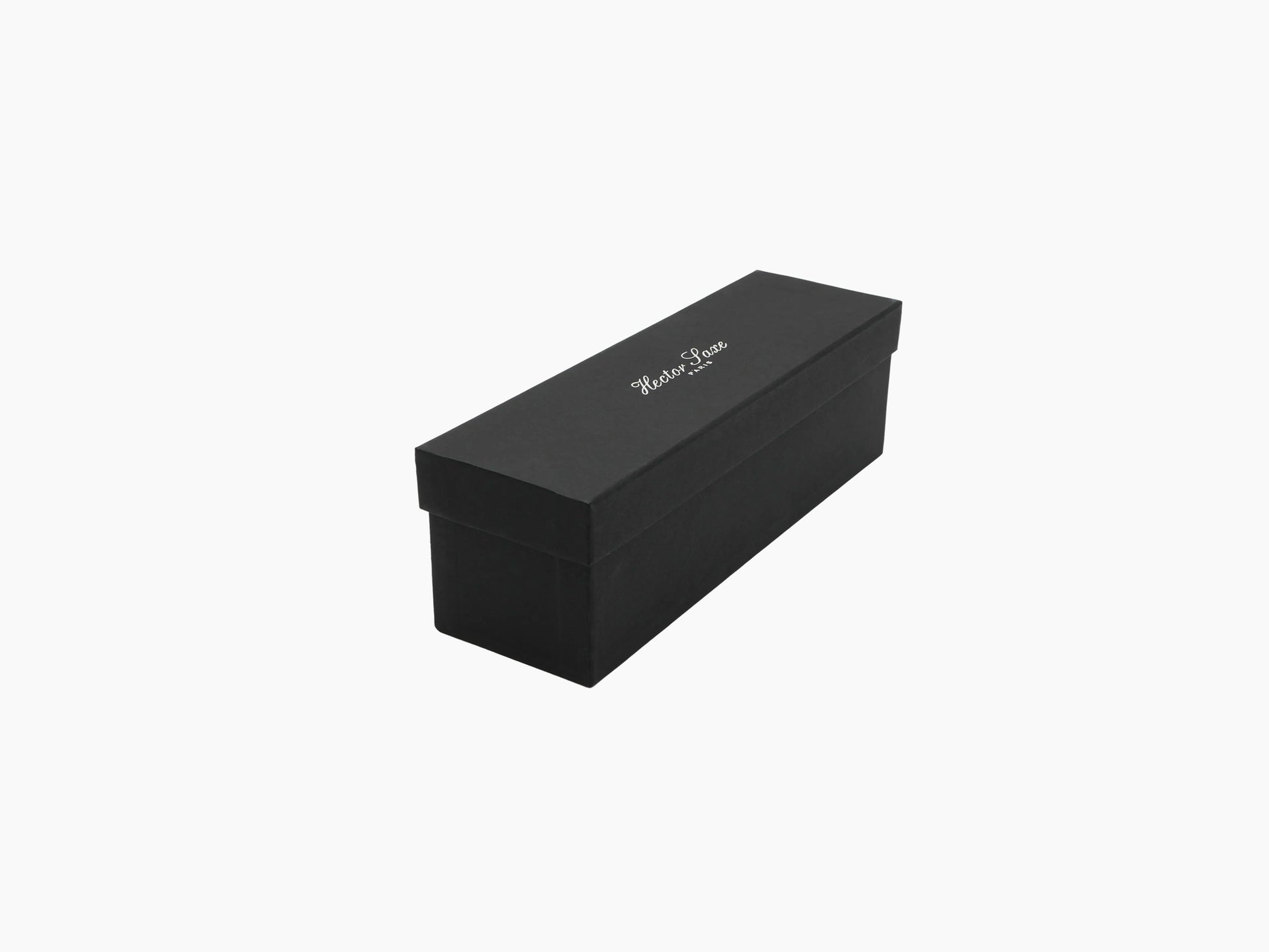 Rectangular black gift box for the backgammon travel set with a lid and subtle logo on top.