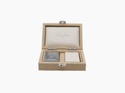 Open beige alligator-embossed card box showing two decks in inner compartments.