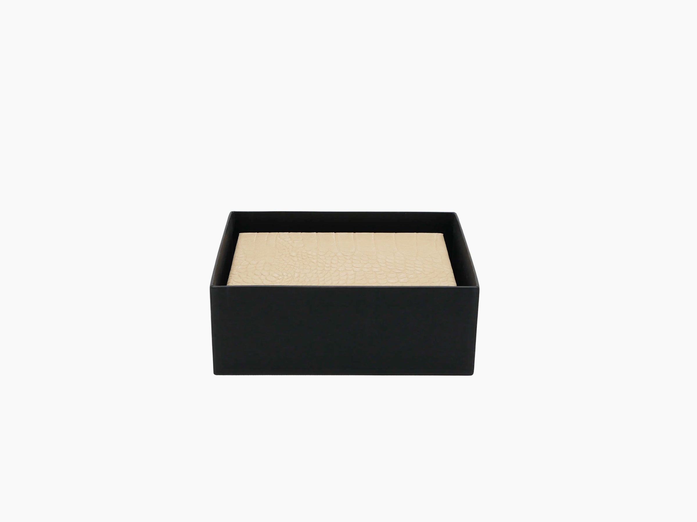 Beige alligator-embossed card box resting inside a black open gift box.