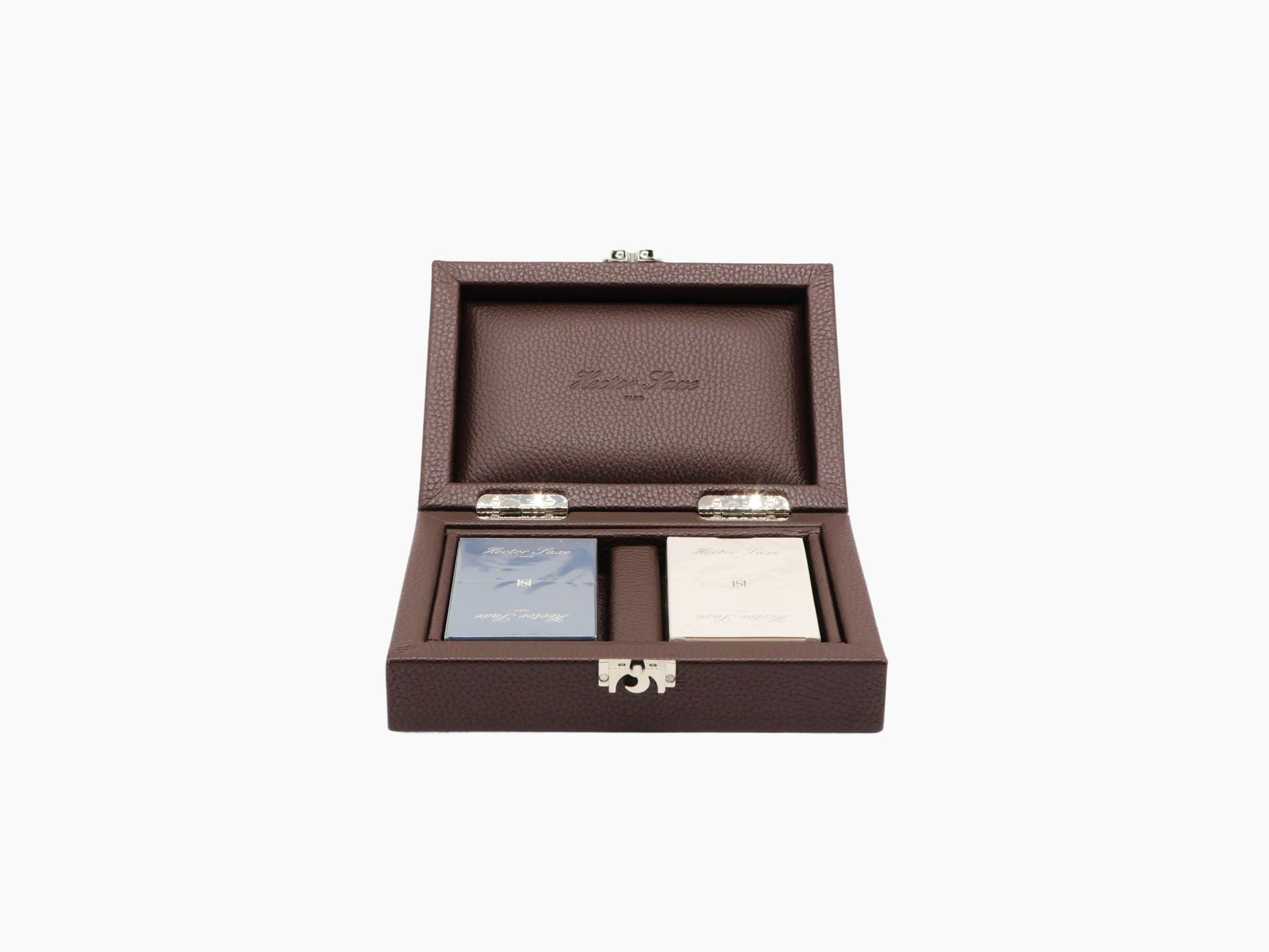 Open brown buffalo leather card box with two wrapped decks inside.