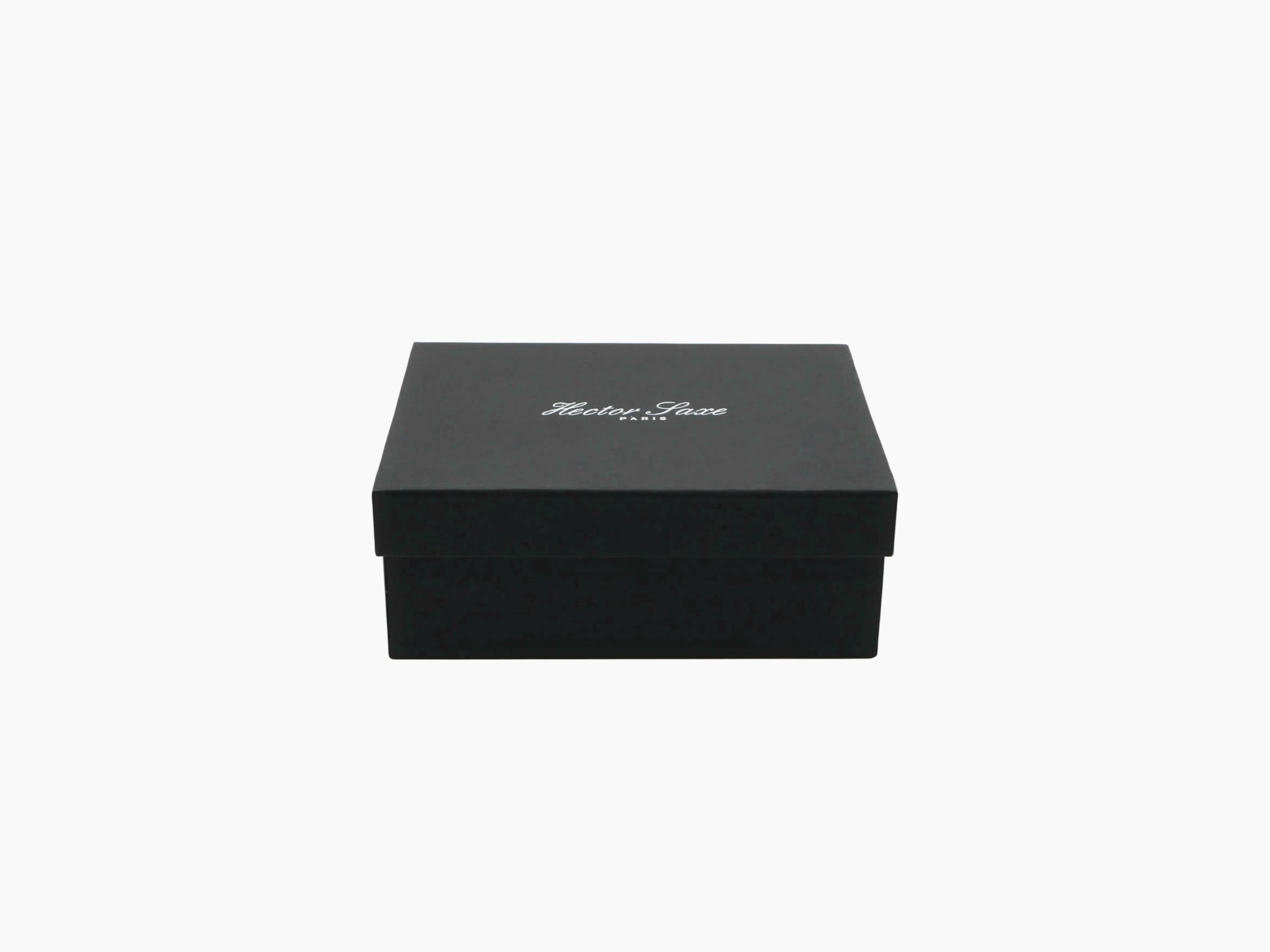 Closed buffalo leather card box in black with a white script logo on the lid.
