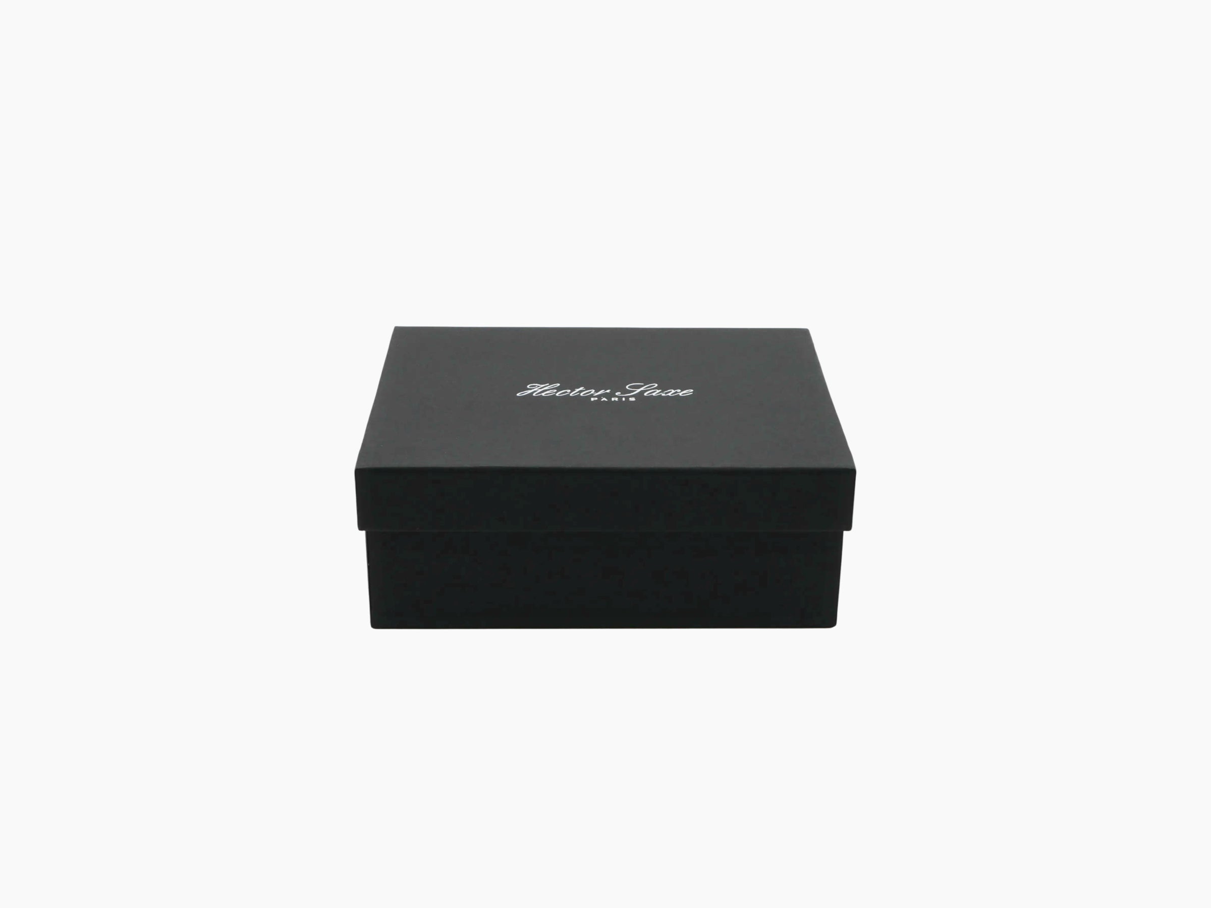 Closed buffalo leather card box in black with a white script logo on the lid.