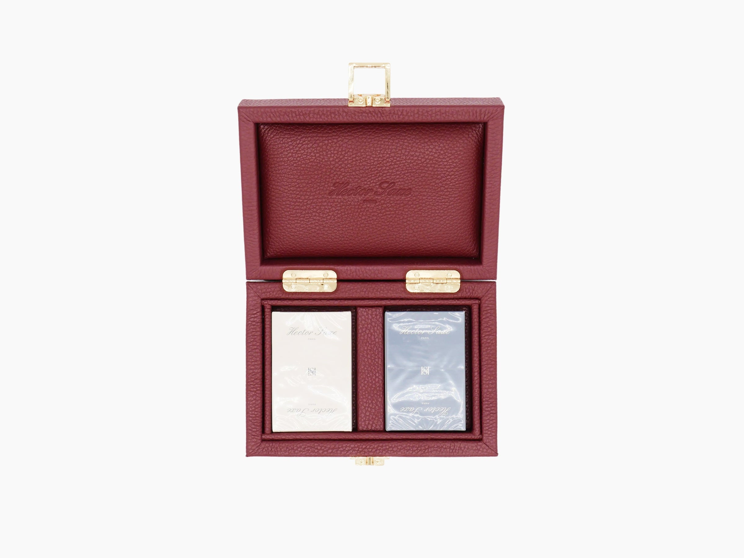 Open burgundy buffalo leather card box with gold hardware displaying two laminated card decks.