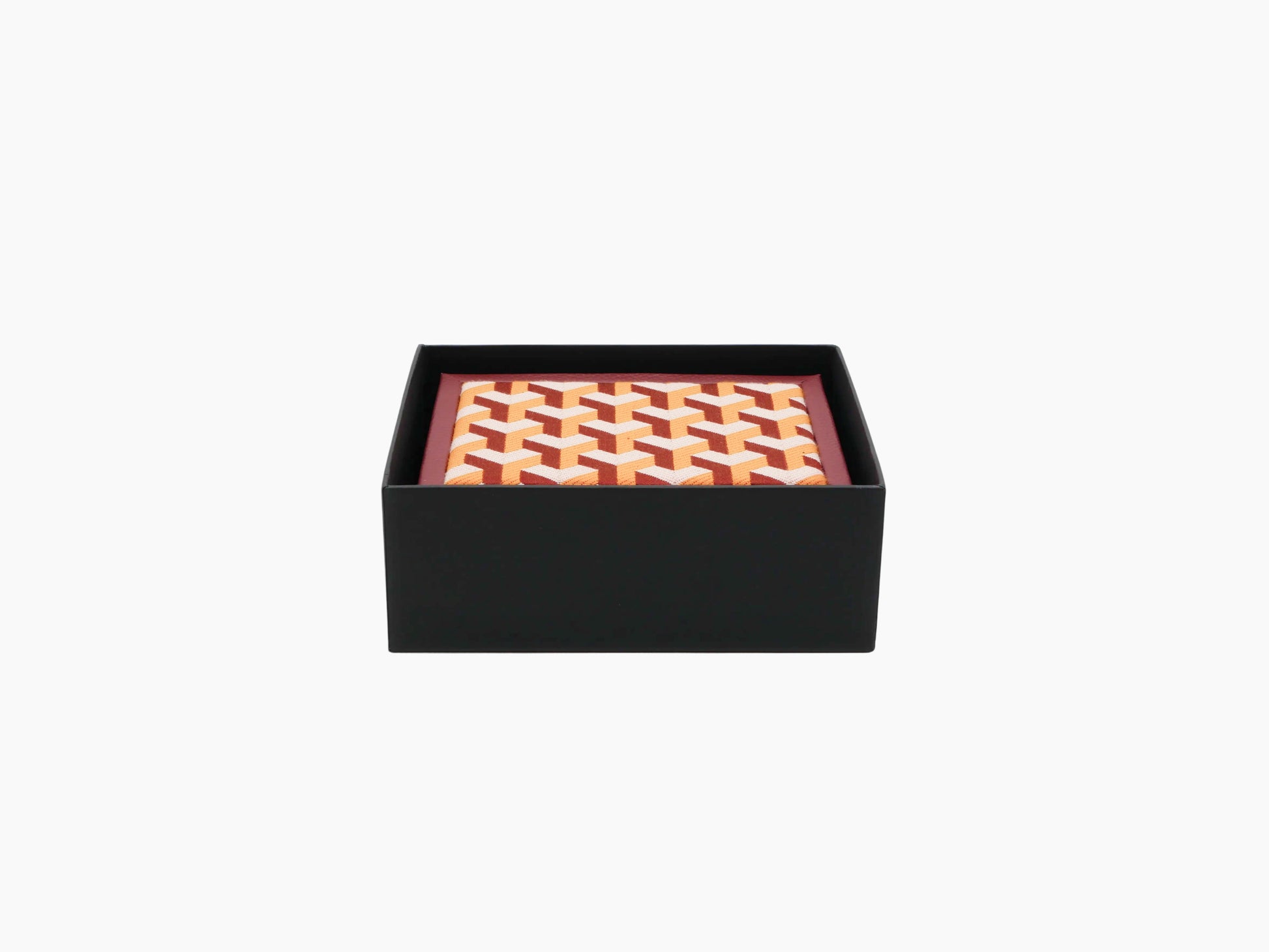 Black presentation box with an orange white geometric patterned textile insert.