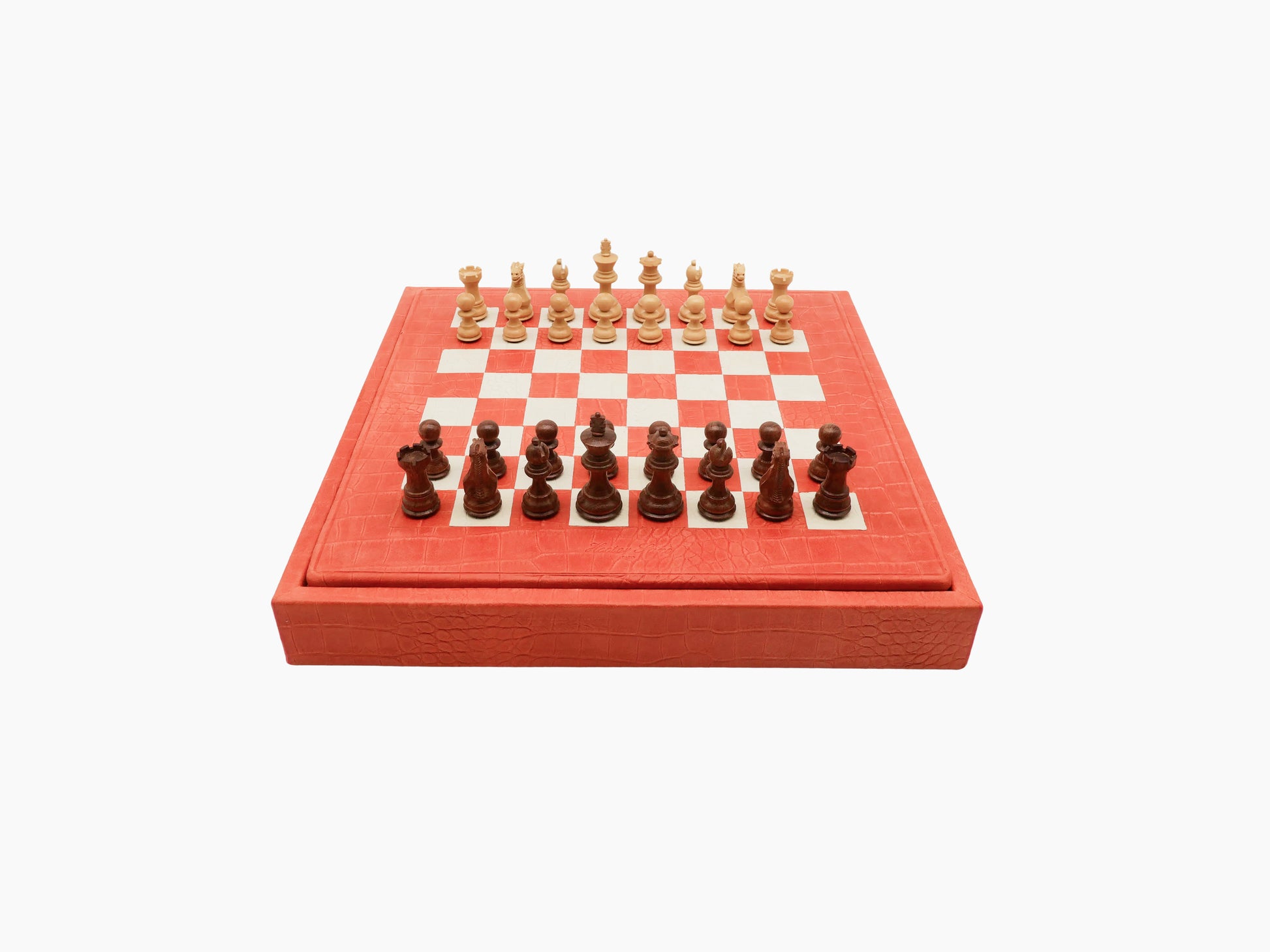 Coral red leather chess box with a built in board visible on top and matching leather exterior