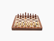 Foldable magnetic chess set open on a rosewood and maple board with Staunton pieces.
