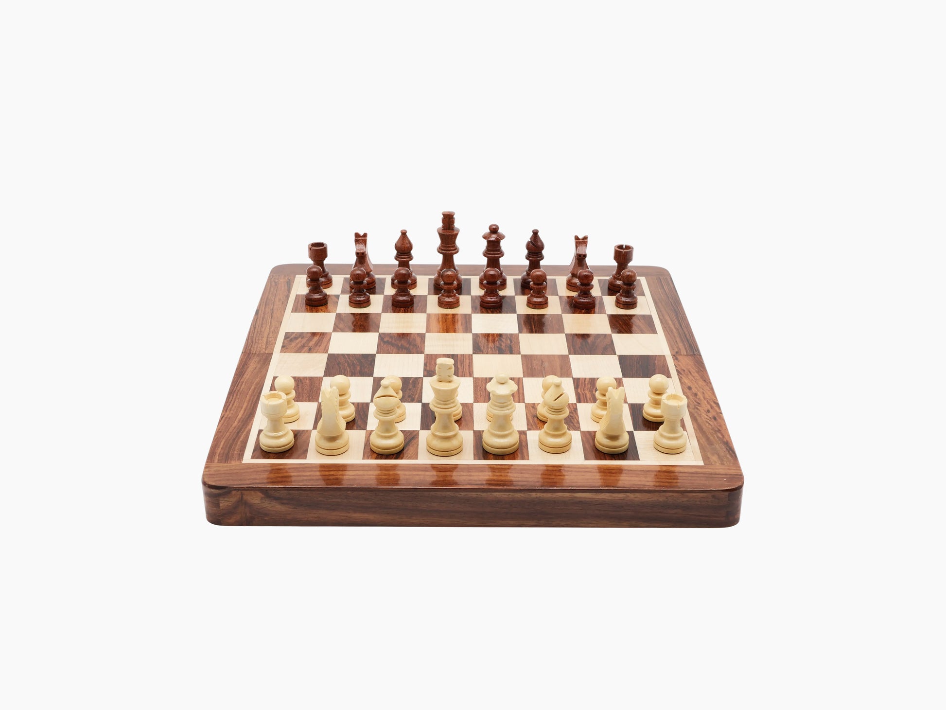 Foldable magnetic chess set open on a rosewood and maple board with Staunton pieces.