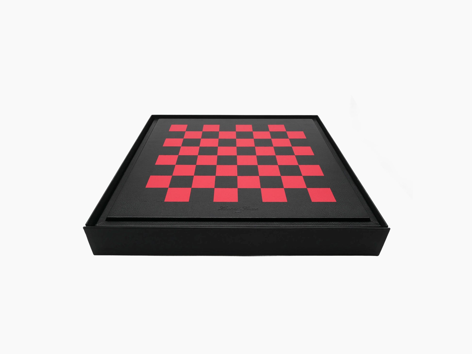 Angled view of the leather wrapped chess box with a red and black checkerboard lid