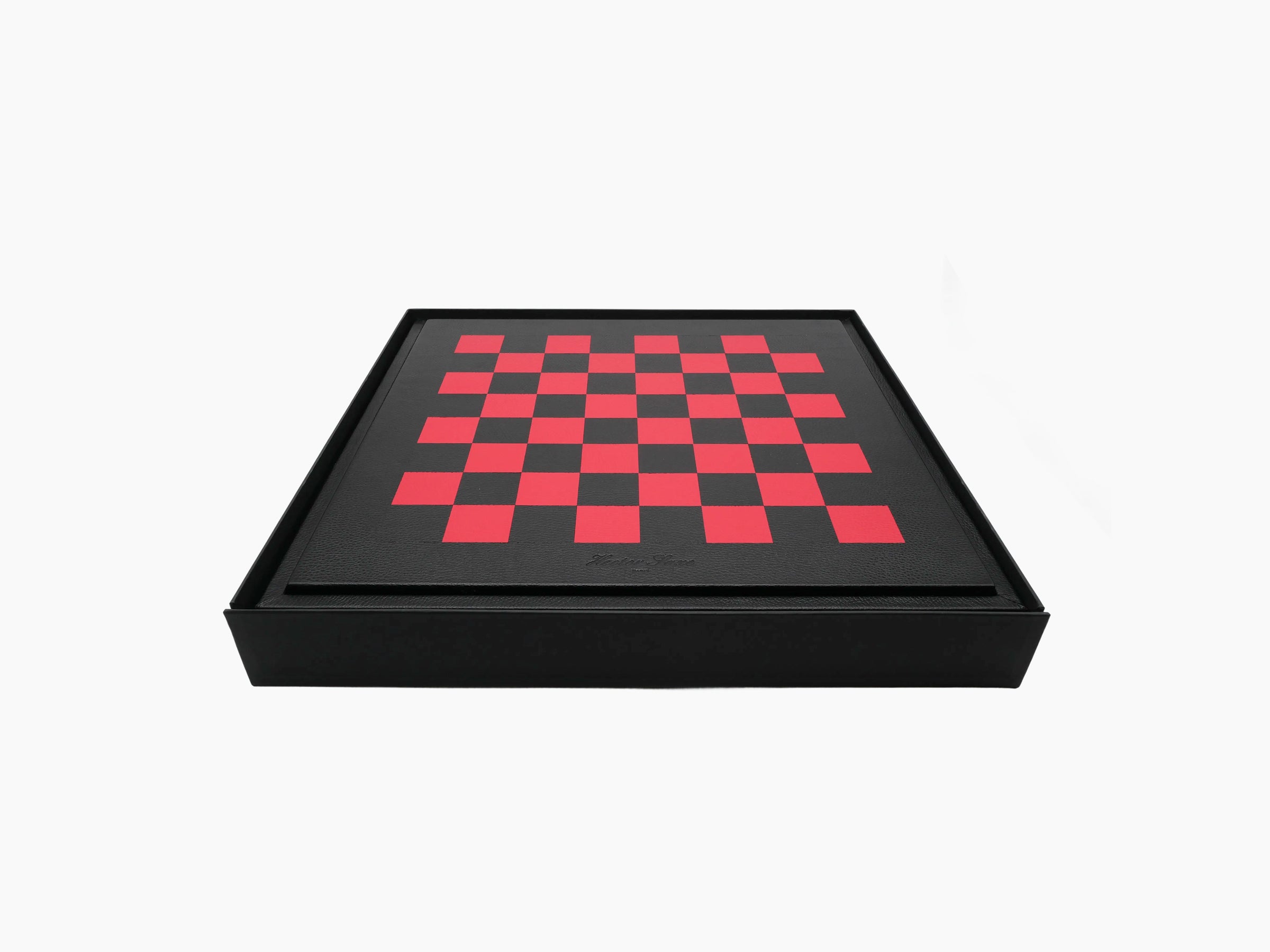 Angled view of the leather wrapped chess box with a red and black checkerboard lid