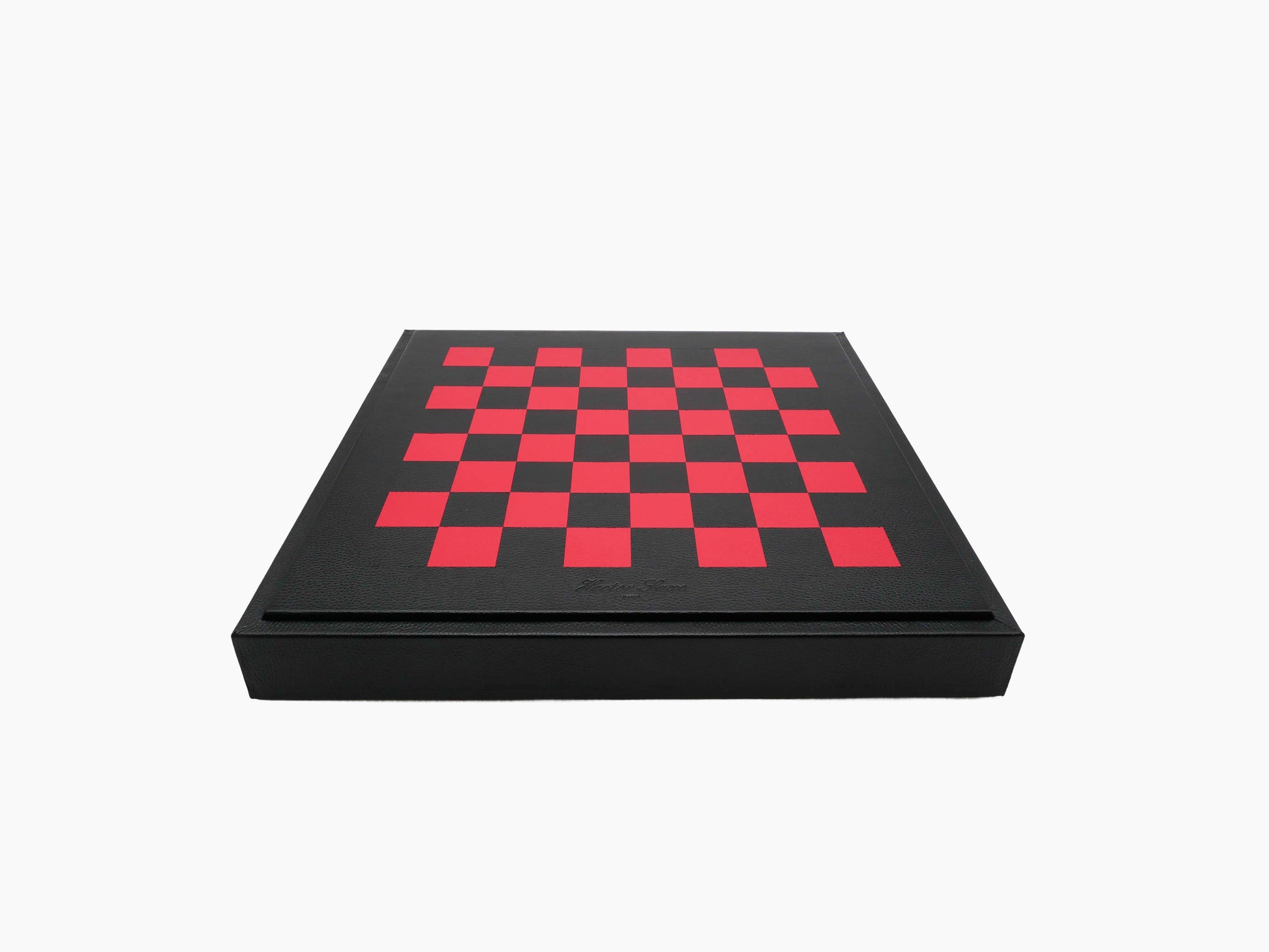 Leather chess box in black with a red checkerboard lid, closed.