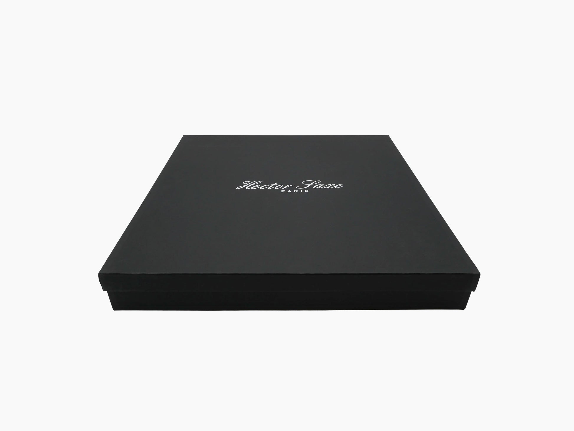 Black presentation box with Hector Saxe Paris logo on the lid, closed.