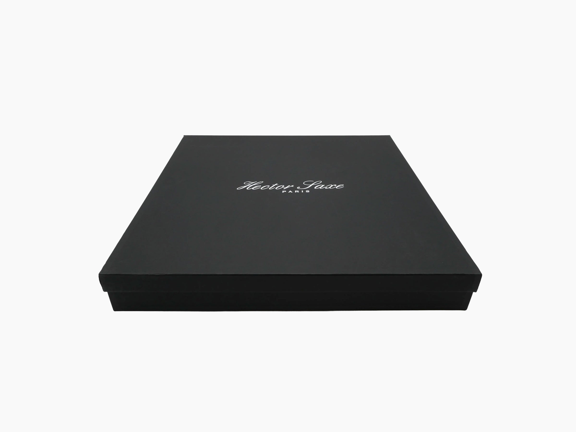 Black presentation box with Hector Saxe Paris logo on the lid, closed.