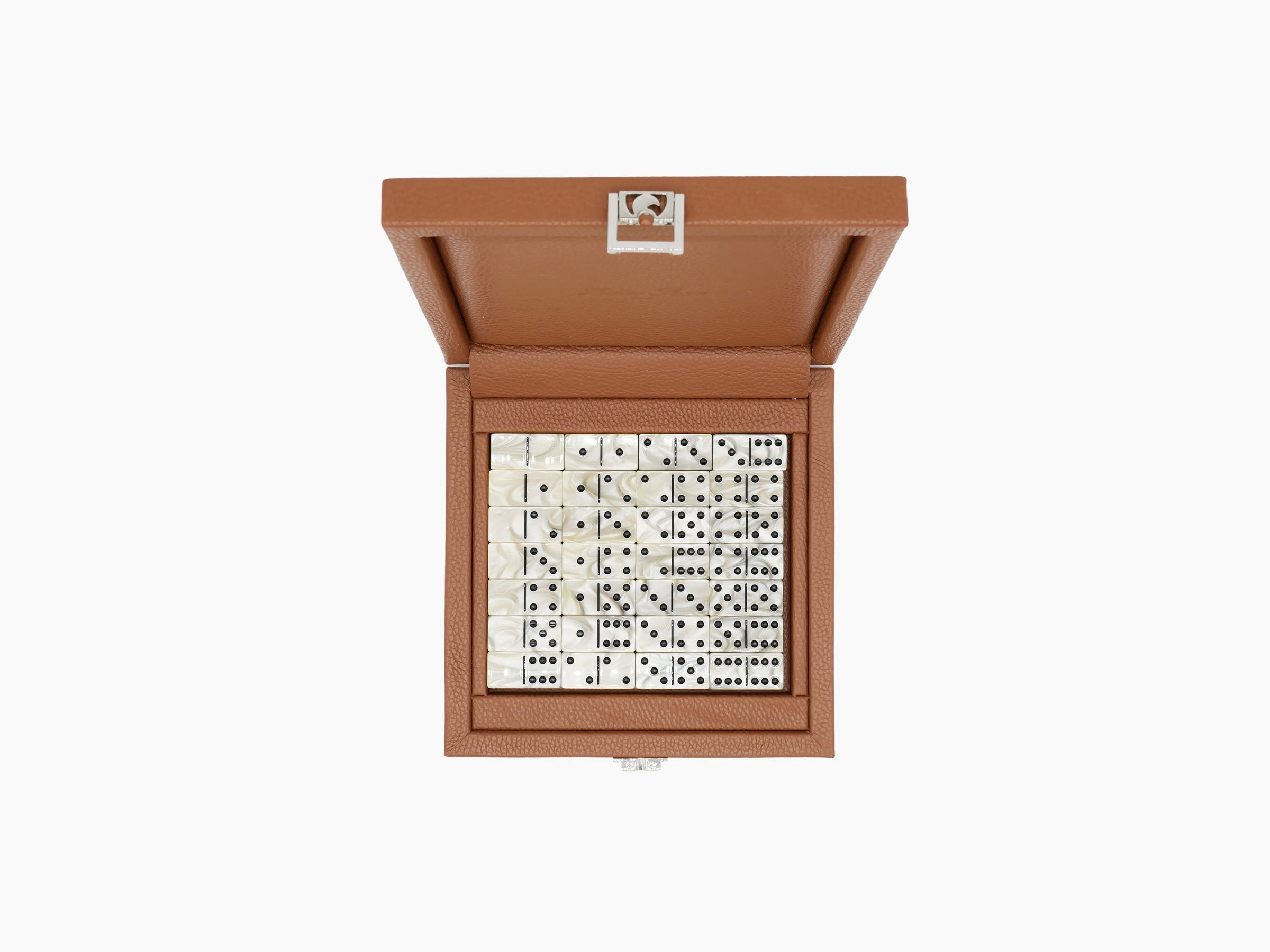 Open brown leather box displaying a complete set of two-tone acetate domino tiles in a tray