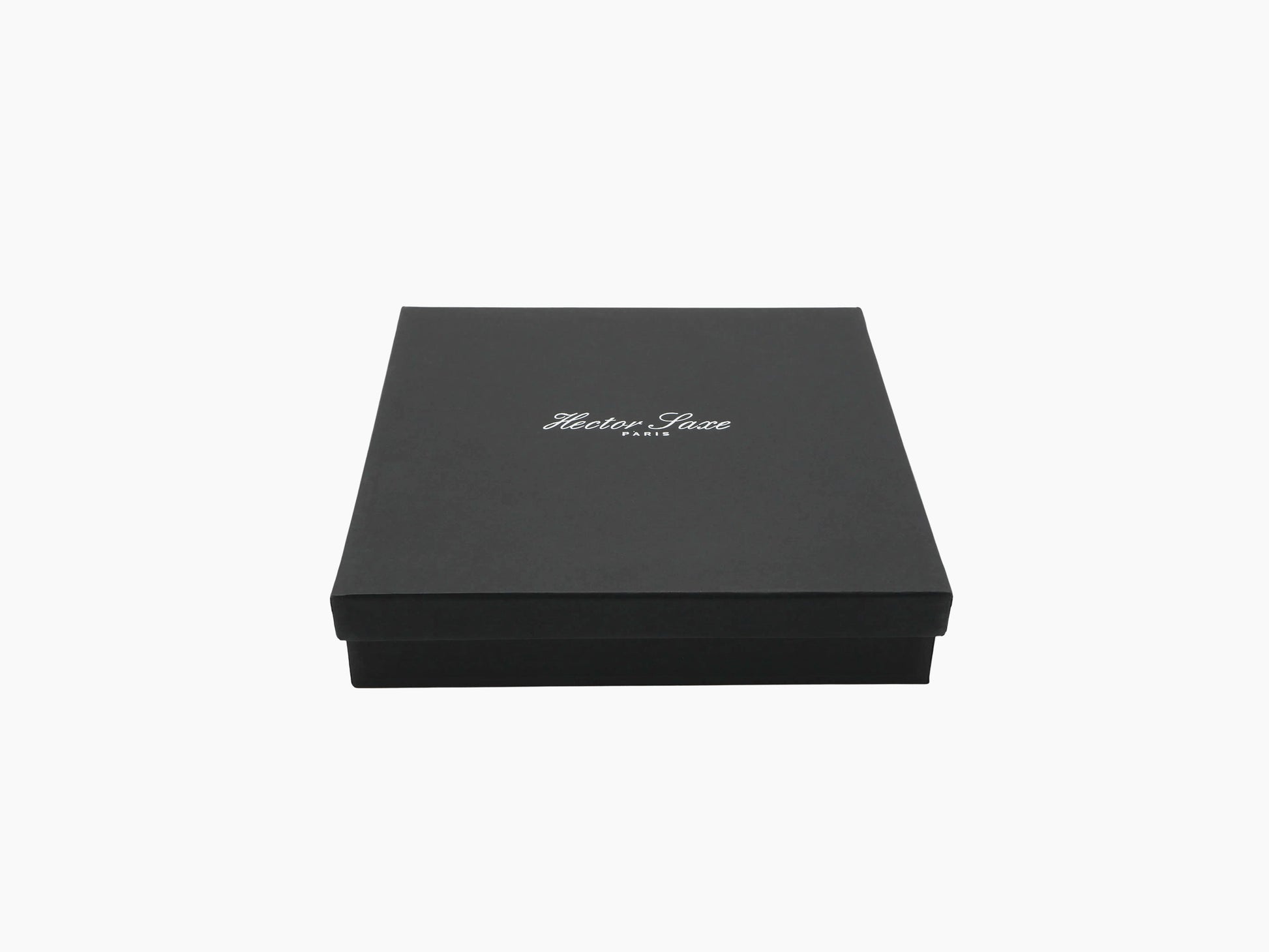 Black gift box with white Hector Saxe Paris logo on the lid