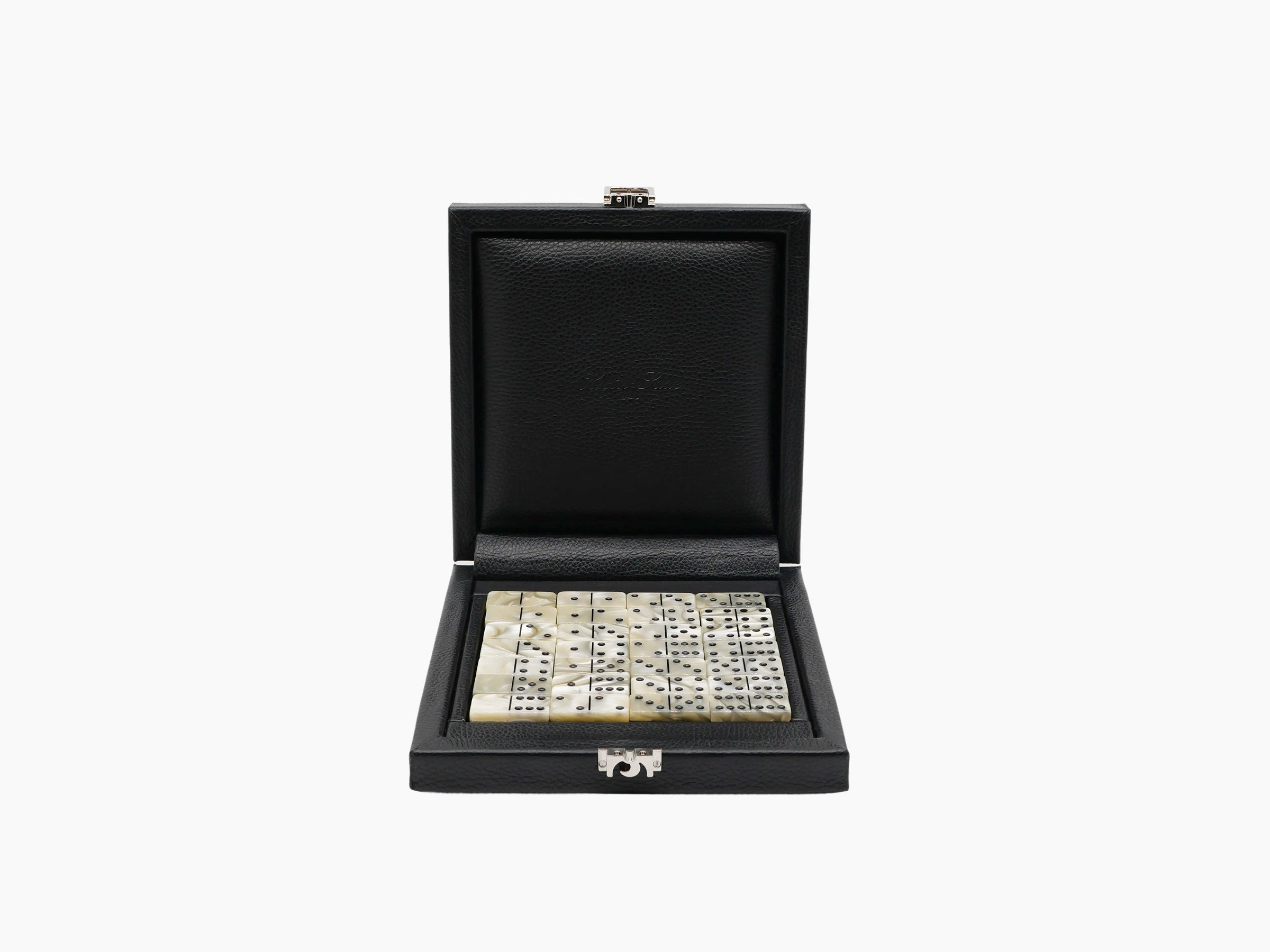 Open black leather domino box with ivory two tone domino tiles arranged inside