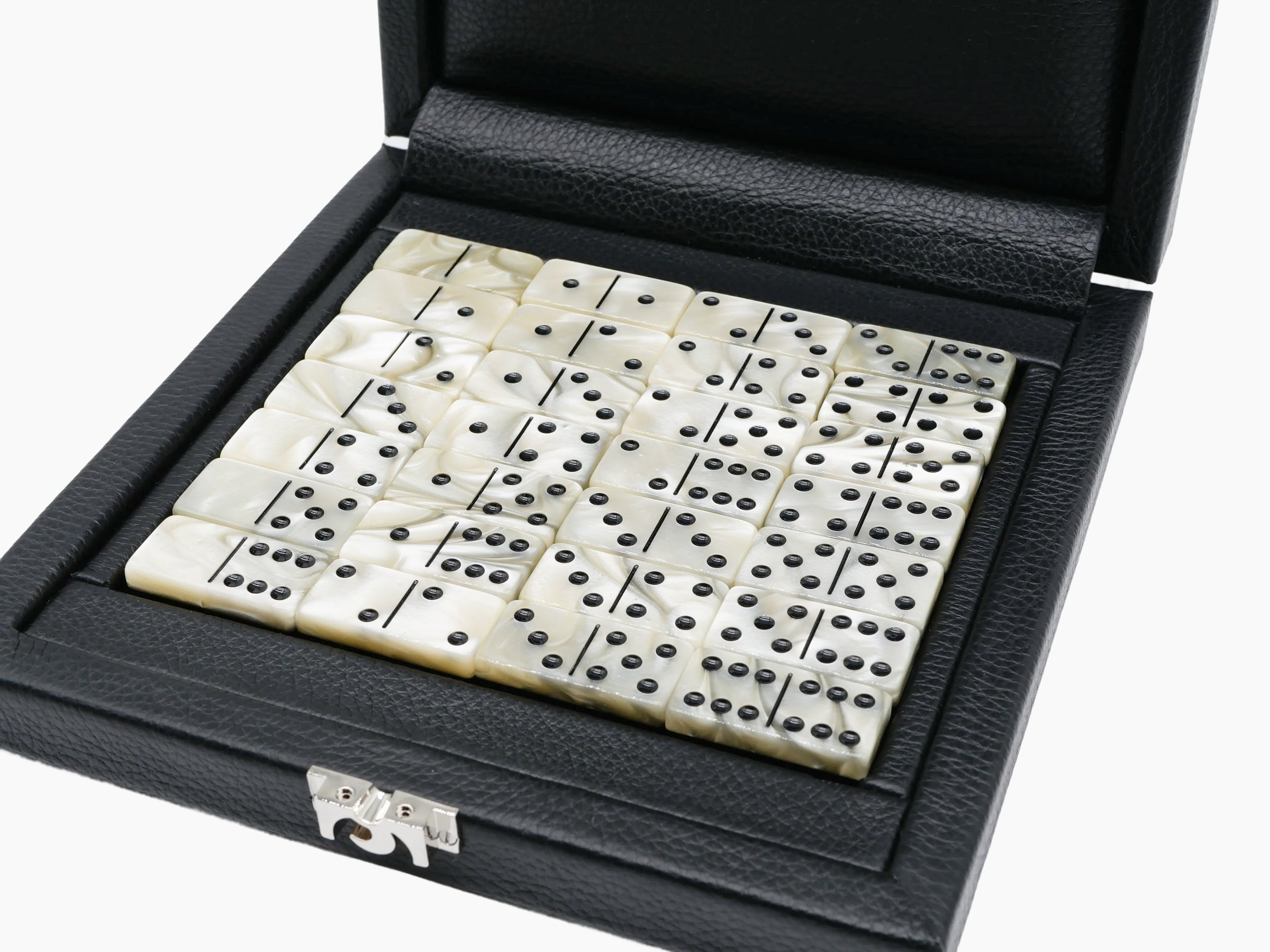 Open black leather domino case filled with ivory two tone domino tiles with black pips