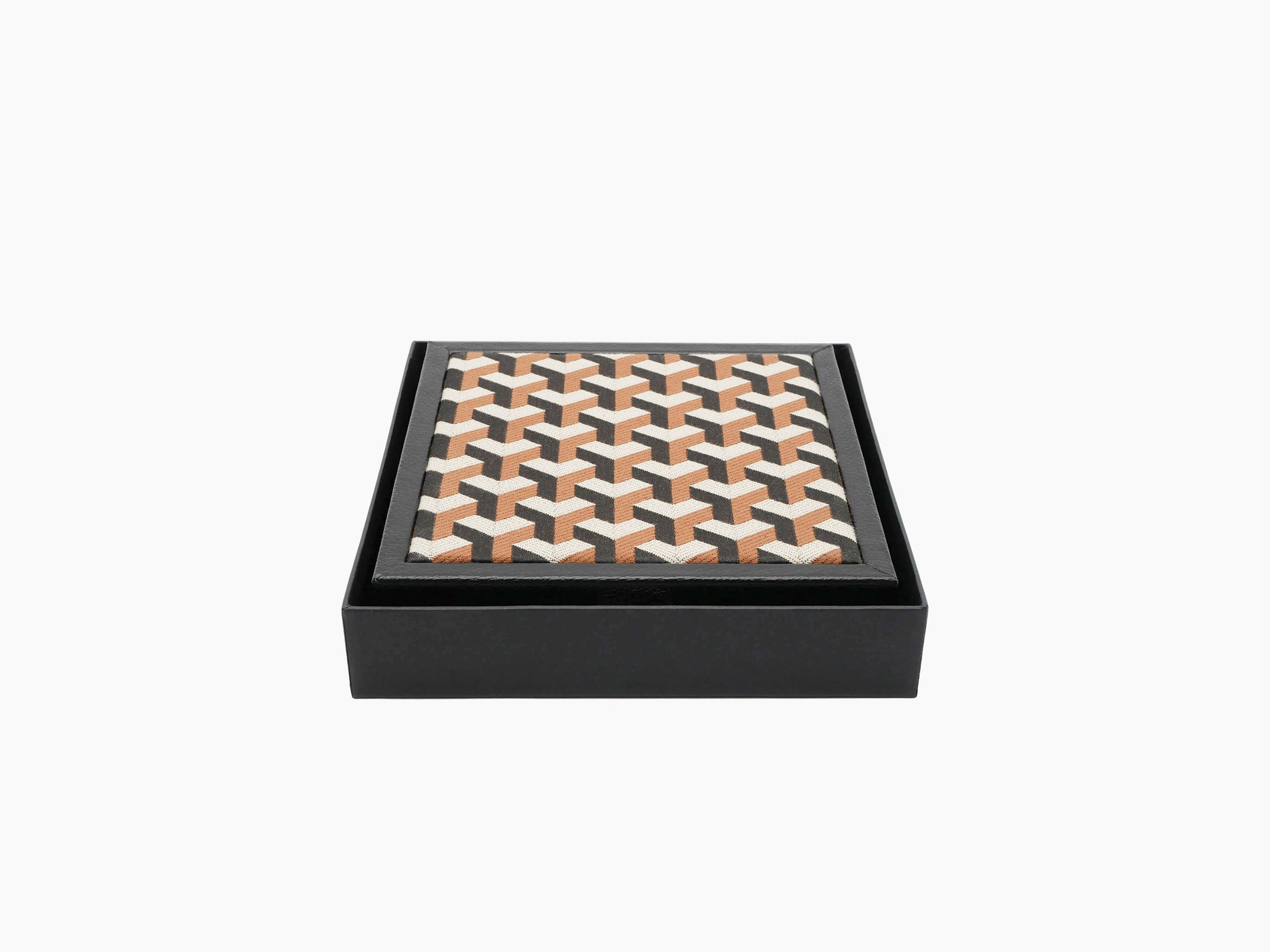 Patterned textile lid on a black leather domino box viewed from an angle