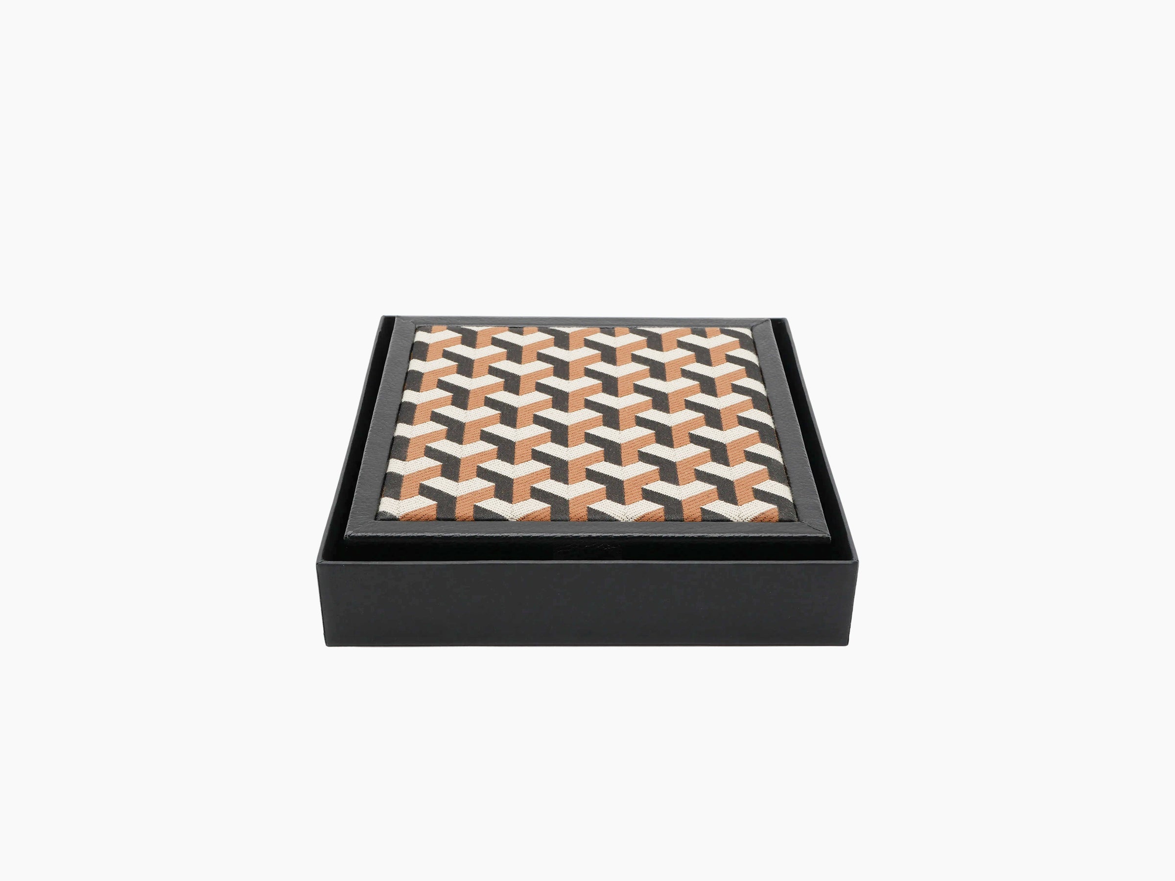 Patterned textile lid on a black leather domino box viewed from an angle