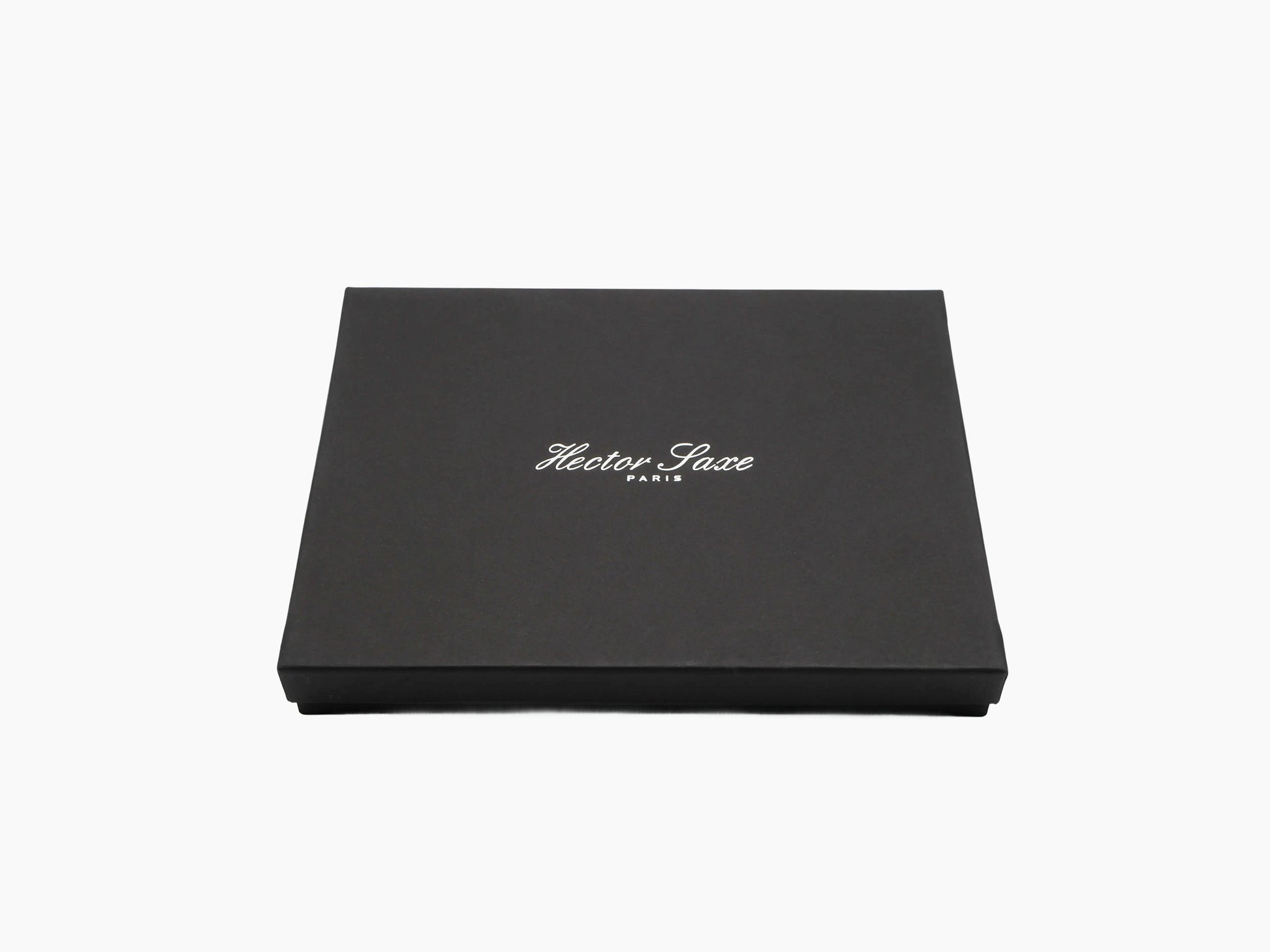Closed black presentation box with Hector Saxe Paris branding on the lid.