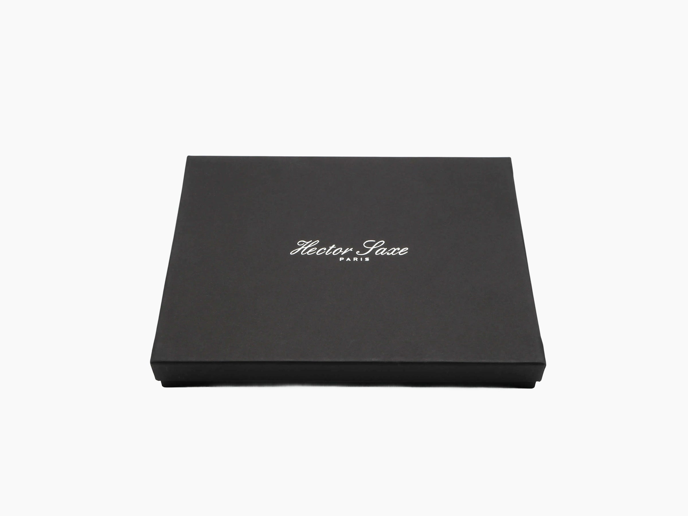 Closed black presentation box with Hector Saxe Paris branding on the lid.