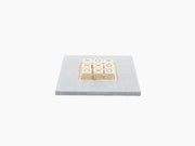 Alligator-embossed leather Tic Tac Toe set with olive wood base and marble X and O pieces