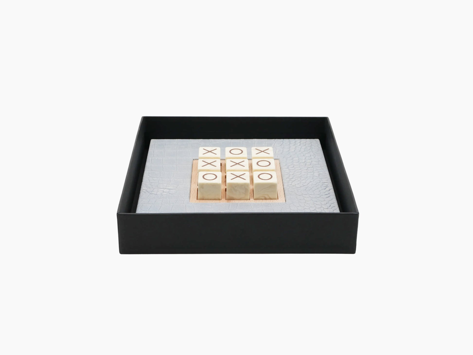 Tic Tac Toe Alligator Ciel set inside a black gift box with pale blue alligator-embossed leather board and marble tiles.