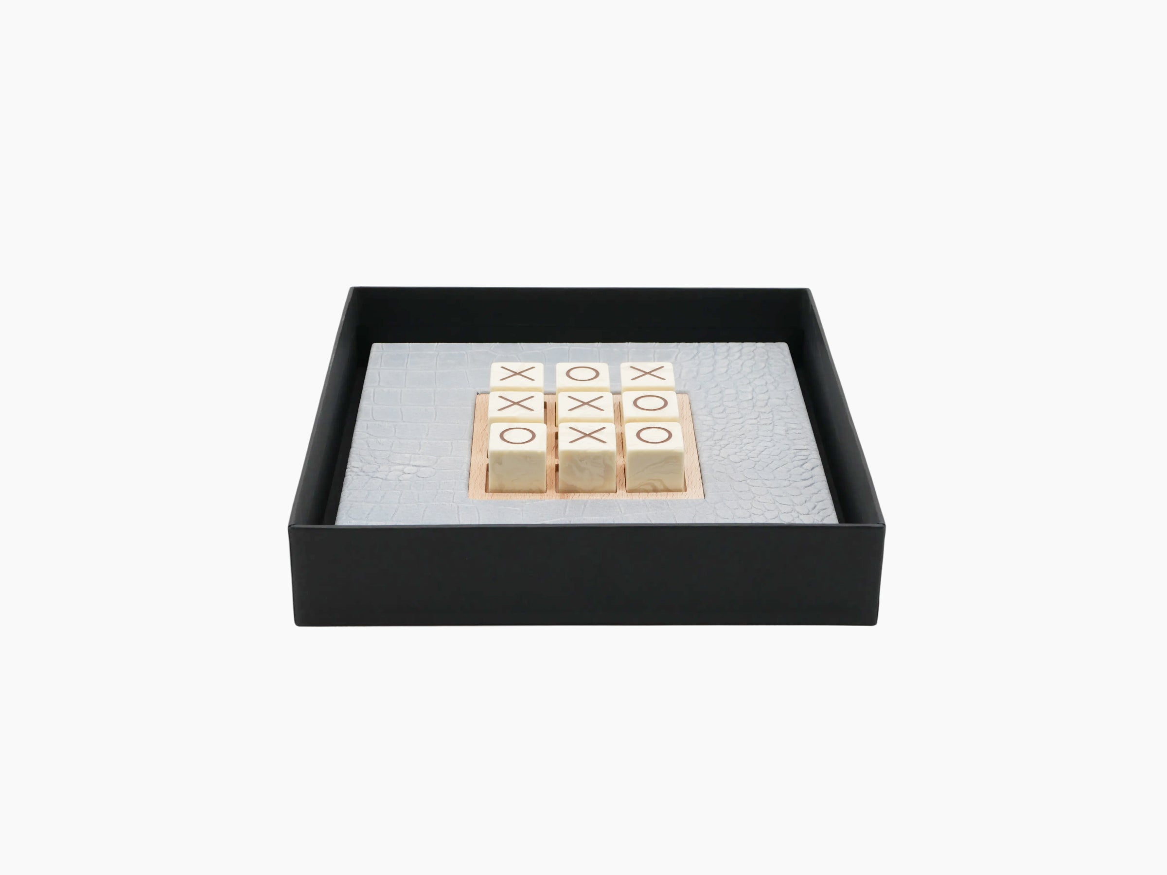 Tic Tac Toe Alligator Ciel set inside a black gift box with pale blue alligator-embossed leather board and marble tiles.