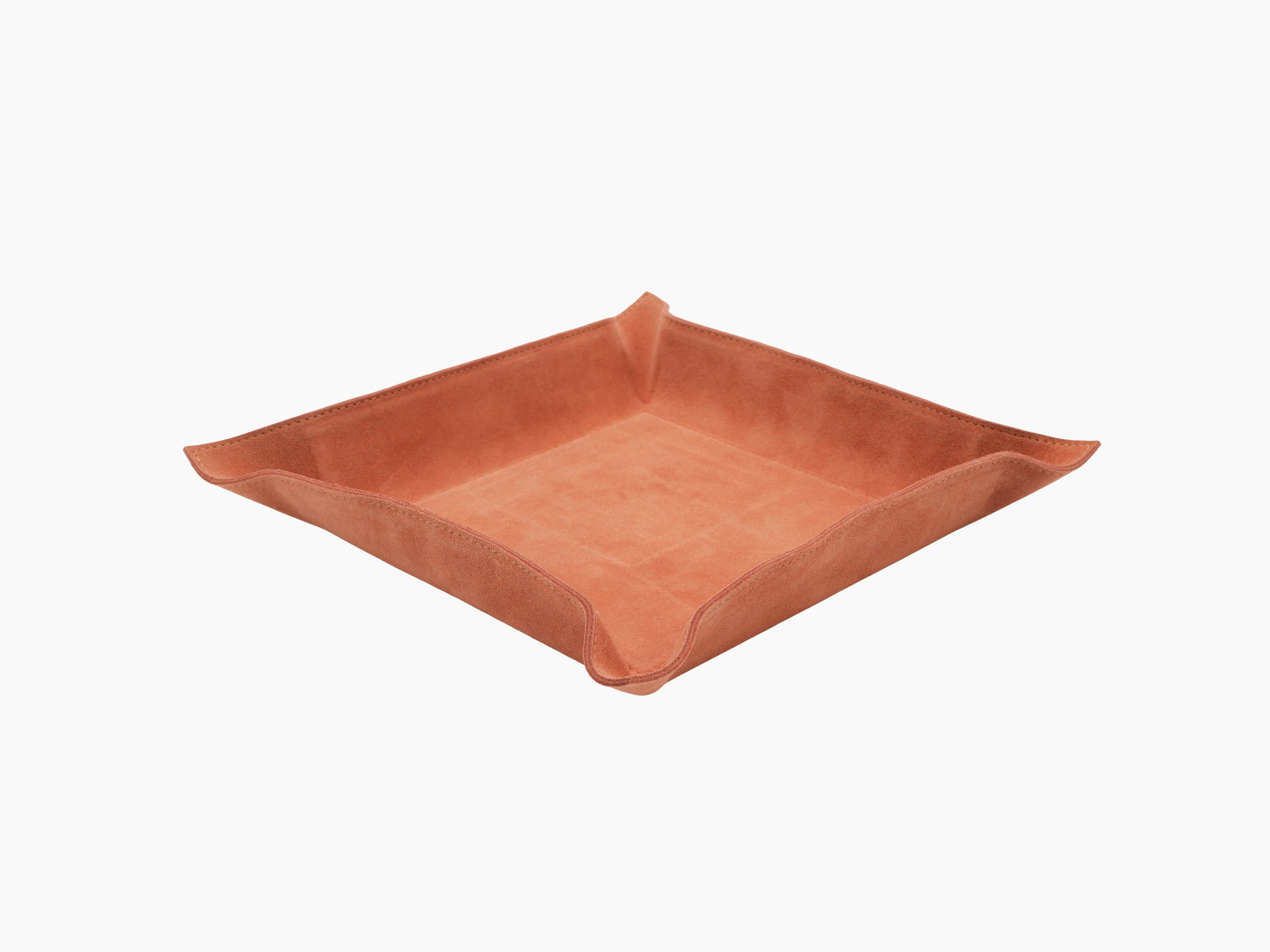 Square orange leather valet tray with curved corners and stitched edges, seen from above