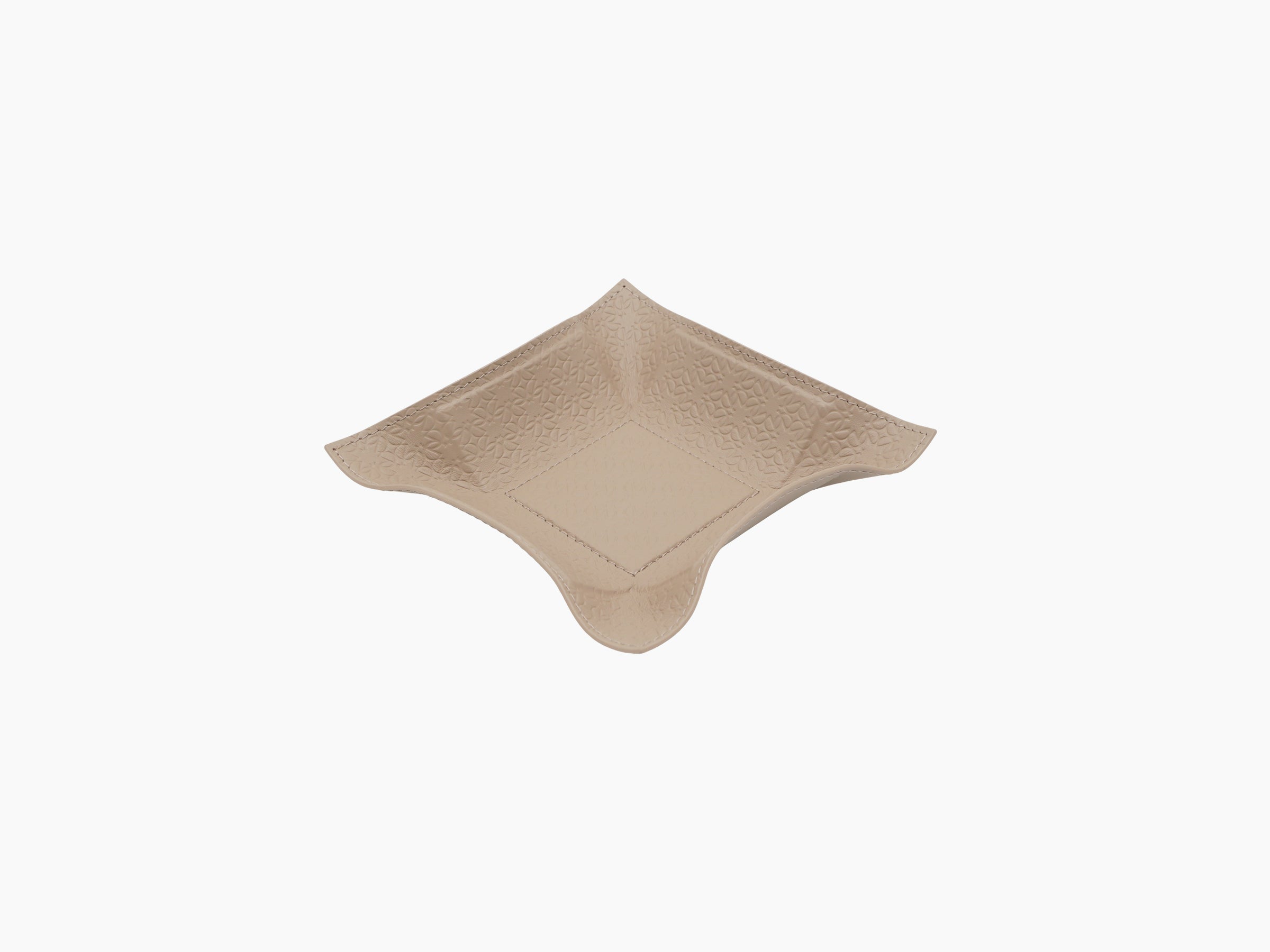 Beige leather valet tray embossed with Elie Saab monogram and curved corners.