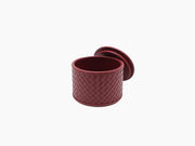 Burgundy Jana Handwoven Round Box with quilted diamond pattern and lid leaning nearby