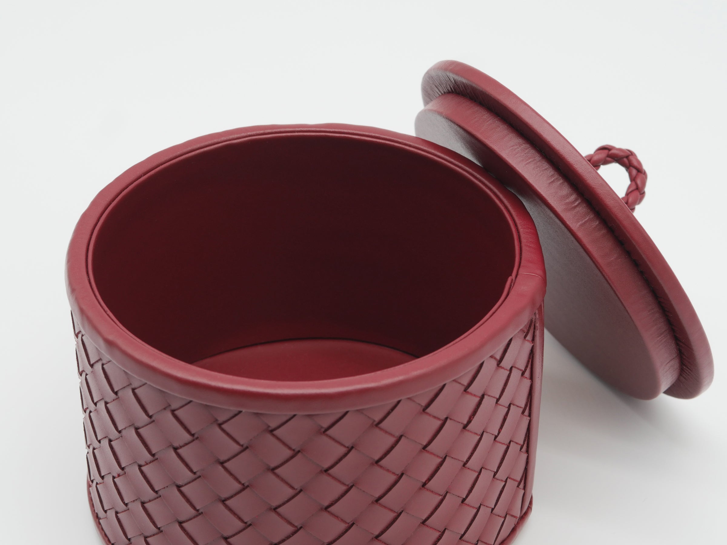 Interior view of Jana Handwoven Round Box showing deep burgundy lining and woven exterior with lid removed