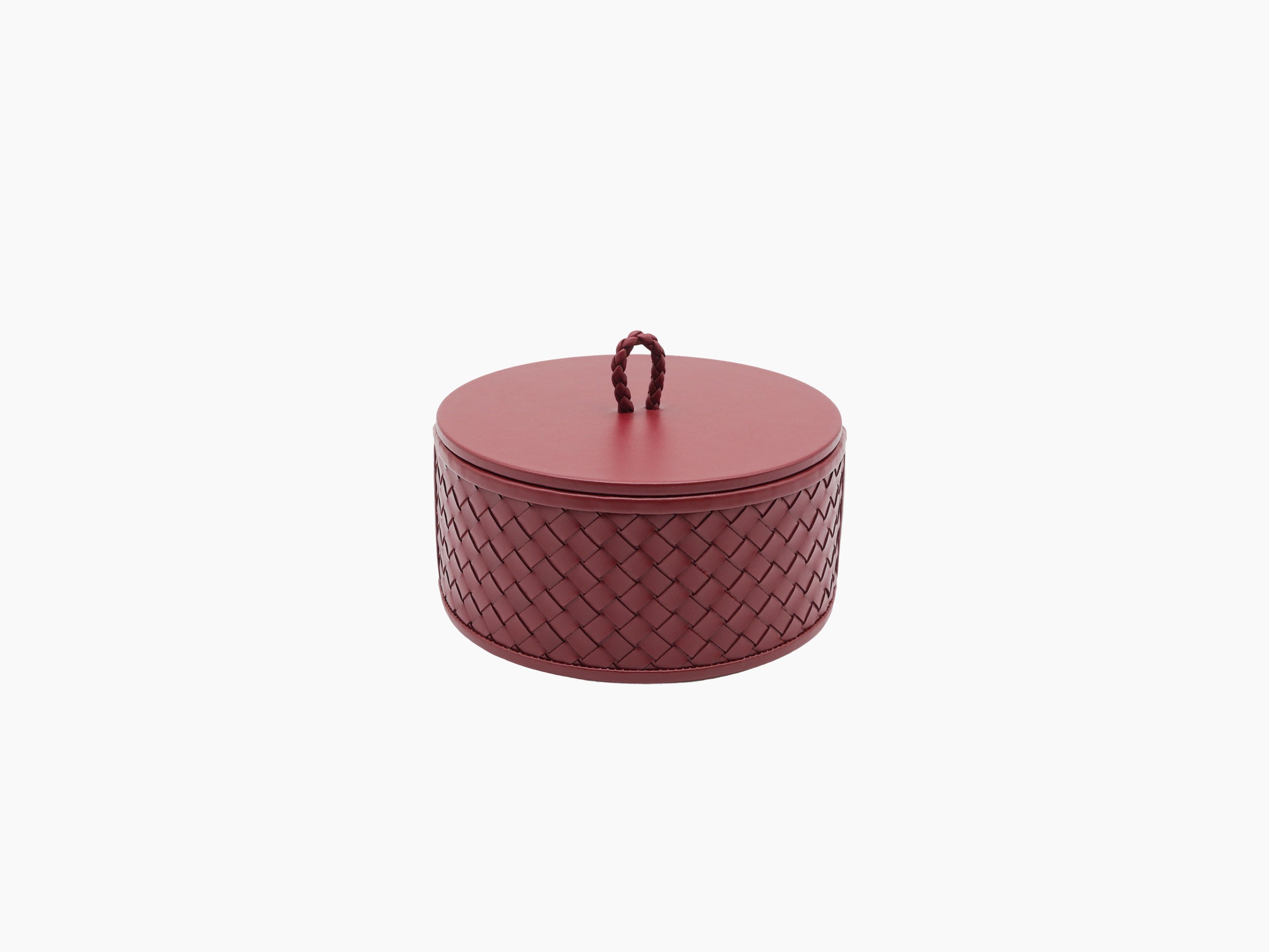 Jana round burgundy handwoven leather box with lid in place and a braided loop on top